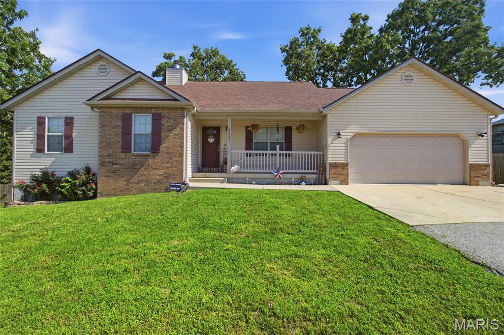 Welcome home to this beautifully maintained 4-bedroom, 3-bathroom home in the highly sought-after Taylor Hills neighborhood of Waynesville! From the moment you arrive, the inviting covered front porch and attractive curb appeal set the stage for everything this exceptional home has to offer.

Step inside to an open-concept floor plan featuring soaring vaulted ceilings, abundant natural light, and a warm, welcoming atmosphere that's perfect for both everyday living and entertaining. The spacious living room centers around a cozy fireplace, while the well-designed kitchen and dining area flow effortlessly together, creating the ideal gathering space for family and friends.

The grand primary suite is a true retreat, complete with a spacious walk-in closet and a luxurious en-suite bathroom featuring a beautiful walk-in shower and relaxing Jacuzzi tub. Downstairs, the finished basement expands your living space with a large family room, a second fireplace, and endless possibilities for movie nights, a game room, or a home office.

Outside, enjoy your own private oasis with a huge fenced backyard, perfect for children, pets, or weekend gatherings on the deck. Conveniently located just minutes from local schools, shopping, dining, and the West Gate of Fort Leonard Wood, this home offers the perfect blend of comfort, convenience, and location.

Don't miss your opportunity to own this exceptional home in one of Waynesville's most desirable neighborhoods. Schedule your private showing today and see why Taylor Hills is the perfect place to call home!