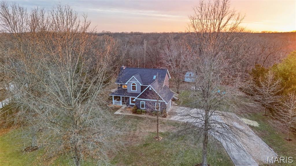 Discover the perfect blend of privacy, recreation and thoughtful updates in this 2-story home set on 3.24 picturesque acres in desirable Callaway Valley.
Offering 4 bedrooms and 3.5 baths with 1,922 sf of finished living space above grade, this home delivers both functionality and flexibility.  Numerous updates have been completed throughout, including refreshed bathrooms and improvements across the interior, creating a move-in-ready feel while maintaining warmth and character.
The walk-out lower level includes partial finishing, providing additional living space with the opportunity to easily complete to your specifications - ideal for a recreation room.
The exterior renovation completed in December of 2025 is a standout feature. Improvements include new siding, roof, gutters, gutter guards, fascia, exterior lighting, an insulated garage door and a low-maintenance composite deck with pergola- perfect for entertaining or relaxing while enjoying the peaceful acreage. Windows were replaced just 2 years ago and include a transferable warranty, offering added value and peace of mind.
Outdoors, the property truly shines. The rare, mostly flat yard provides ample space for play, gardening and exploration. Enjoy summer days in the large above-ground pool or take advantage of the spacious barn/shed with electric-ideal for hobbies, storage, or small equipment. A dedicated garden area adds to the property's versatility for those seeking a more self-sustaining lifestyle.
Ownership includes access to Callaway Valley's private, gated 160 acre lake, offering fishing, boating a beach and pavilion amenities- an exceptional recreational benefit that enhances the overall lifestyle appeal of this property.
If you've been searching for acreage, updates and lake privileges in one cohesive package, this property delivers.