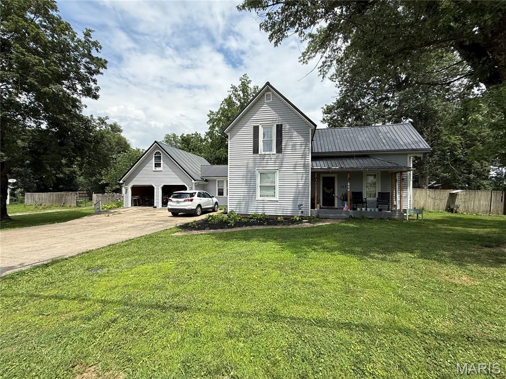 Charming farmhouse-style home with plenty of room for a large family! This beautifully updated home blends original character with up-to-date finishes, featuring granite countertops, farmhouse-inspired details, and an ample amount of living space throughout. The home offers 4 spacious bedrooms, with a loft over the 2-car attached garage, a living room and separate family room that includes a gas burning fireplace. Enjoy the privacy and outdoor space of the fully fenced backyard. Situated on just under 3/4 of an acre. For those needing extra storage or workspace, you'll appreciate the 25'X30' shop building along with an additional storage shed. This home is ready to welcome its new owners!