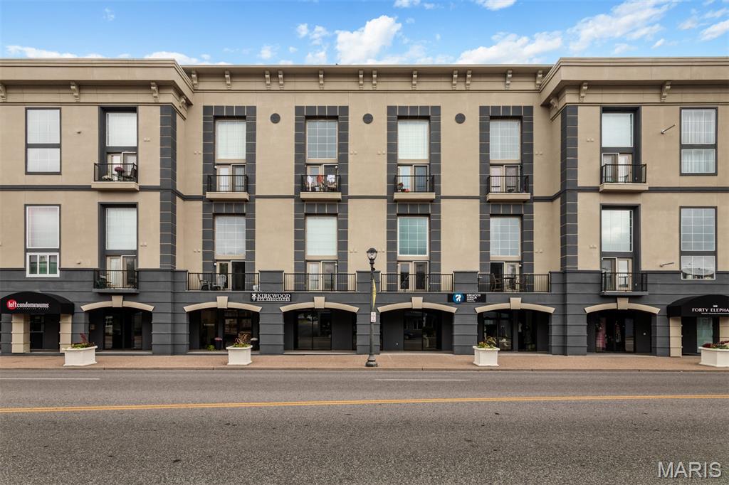 Exceptional condo in desirable Kirkwood area. Enter into a gorgeous open floor plan with high ceilings and tons of natural light from the huge statement window. Kitchen features custom white cabinets, tiled backsplash, solid surface countertops, stainless steel appliances, center island and breakfast bar. A convenient half bath is located just right off the kitchen area and don’t forget to check out the built-in bar with wine fridge, tons of counter space and storage. The living room is spacious adding amazing architectural touches from the high ceilings, beams, stone accents and has doors leading to the balcony. Up the stairs you will find a large loft-style bedroom with an oversized closet. Also on this upper level is a nice-sized private bathroom with many updates and a personal laundry room for great convenience. Some bonus features that come with this condo include secure covered parking w/extra storage space, fitness center, elevators and a massive clubhouse. The clubhouse features a large entertaining area, technology/business space, full kitchen and dining areas. Enjoy being just steps from your favorite restaurants, shopping centers, markets and entertainment venues. Do not hesitate in making your appointment today to come see this condo, you will not be disappointed!