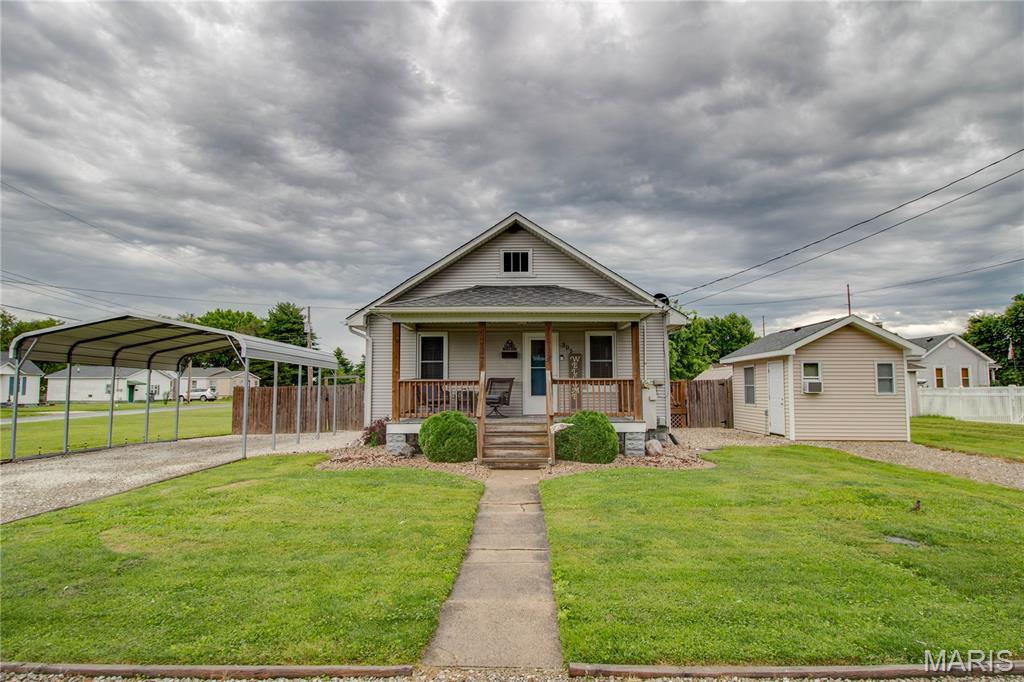 Adorable move-in ready 2-bedroom, 1-bath home situated on a nice corner lot! This charming property features hardwood floors throughout most of the home and an eat-in kitchen with a built-in pantry, under-cabinet lighting, and stainless-steel appliances. The electric range, vent hood, and dishwasher were all new in 2022. The full unfinished basement provides plenty of storage space and includes a washer and dryer that were new in 2024. According to the previous owners, the roof was replaced prior to their purchase in 2020. 
Outside, you'll find a carport, a spacious fenced backyard. Enjoy relaxing or entertaining on the rear deck. The property also includes a utility shed and a detached shed with electricity. Originally built as a "cigar shed," this versatile space offers endless possibilities as a workshop, hobby room, home office, studio, or retreat.  Seller is selling as is.
Don't miss this opportunity—schedule your showing today before it's gone!