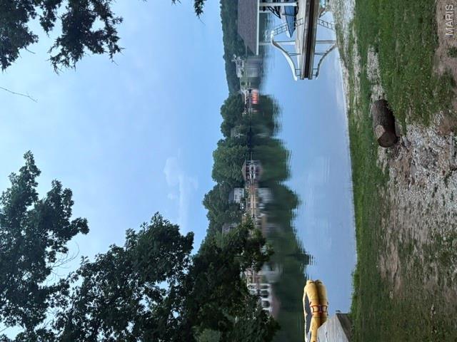Build Your Dream Getaway Home or Permanant Resident on the 2nd Tier of Autumn Lake, across from the main lake! Great Lot with a common area walk way access to Autumn Lake just accross the street - Great Opportunity to enjoy Raintree and its finest ameneties! WOW! Beautiful Views!!! Whether you're looking to build your dream home or simply enjoy the perks of ownership, this lot offers exceptional value and access to everything Raintree Plantation has to offer. Live like you're on vacation every day with resort-style amenities, including: 4 private community lakes for fishing, boating, kayaking, large beach area, swimming, and scenic lake views golf course, country club, and on-site restaurant; hiking trails 1/4 mile from entrance, biking, campgrounds, pickleball and sand volleyball. A golf cart-friendly community for relaxed neighborhood living Ownership includes access to the Country Club for just $271/year, and full community amenities for only $250/year. All of this just 35 minutes from South County (63128)! See all photos for a glimpse into the incredible Raintree lifestyle. As a resident myself, I can confidently say: it’s an amazing place to live, play, and relax. Come join us! (Survey Included)