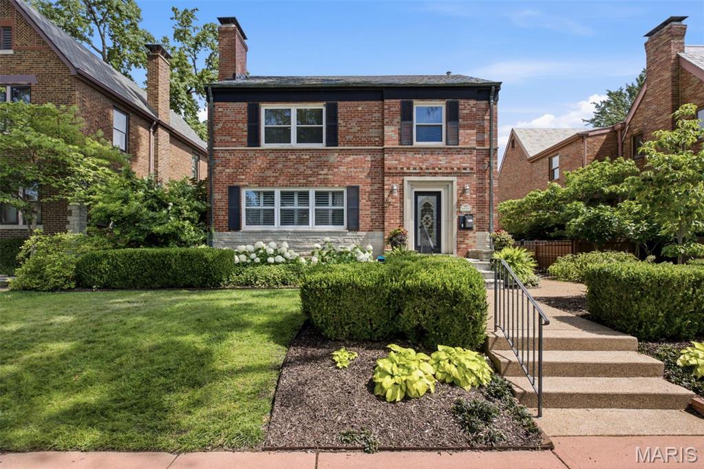 Welcome to 6551 Itaska. This stunning St. Louis Hills home is located one of the most beautiful streets in one of the most iconic neighborhoods in St. Louis. This two story home features gleaming hardwood floors throughout. The first floor has a spacious living room with a gas log fireplace. Both the living and dining have Plantation Shutters. The Kitchen has been updated with 42" cherry  cabinets w/under cab LED lighting, stainless steel appliances( Bosch dual fuel range w/ electric convection oven/gas cooktop & warming drawer, GE Profile refrigerator, KitchenAid dishwasher and microwave), Quartz countertops, and subway tile backsplash. There is also a sunroom/den looking out on to the spacious backyard. The second floor boasts three large bedrooms and a full bath with heated floors. The finished lower level has a wet bar, wood burning fireplace, full bath and plenty of storage. The spacious backyard sports a large patio, two car garage and children's play set. The professional landscaping is eye-catching. The new roof has been installed in June 2026.