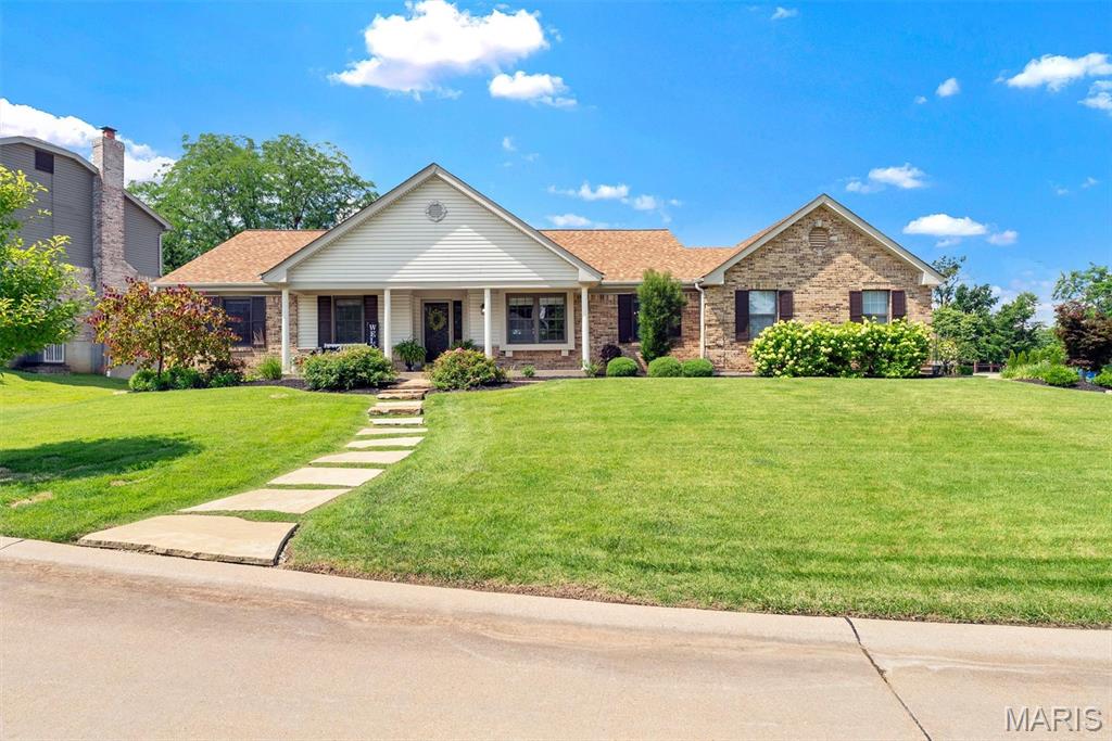 Welcome to 2348 Fairwood Forest Court, a beautifully updated 4-bedroom, 2-bath ranch in the sought-after Clarkson Crossing subdivision, served by the award-winning Rockwood School District and highly desired Marquette High School. With 2,312 square feet of true one-level living, an open floor plan, and an exceptional list of high-end improvements completed over the past several years, this home is the rare find that is genuinely move-in ready. A flagstone walkway and professionally designed landscaping welcome you to the front door. Step into the entrance foyer and take in a bright, airy interior where vaulted and cathedral ceilings, skylight, and a charming bay window flood the main living spaces with natural light. The great room, elevated by designer architectural molding, shares a striking double-sided wood-burning masonry fireplace with the breakfast room, creating a warm, inviting heart of the home. The showstopper is the completely redesigned kitchen: a smart new layout with center island, custom cabinetry, gleaming Caesarstone quartz countertops, stainless steel appliances, Blanco Silgranit sink, designer backsplash and a pantry professionally designed by St. Louis Closet Co. A separate formal dining room offers the perfect setting for holiday gatherings. Rich hardwood floors, fresh paint throughout, updated lighting fixtures on the main level, bamboo blinds, and updated door hardware create a cohesive, contemporary feel in every room. The primary suite is a true retreat, featuring a walk-in closet professionally designed by St. Louis Closet Co and a redesigned, enlarged spa-style bath with double-sink vanity topped in quartz, soaking tub, separate shower wrapped in marble tile, porcelain tile floors, updated fixtures, lighting, and mirrors, plus a space-saving pocket door to the closet. Three additional generously sized bedrooms and a fully updated hall bath. The main-floor laundry/mud room with utility sink sits conveniently off the attached two-car garage. Outside is every bit as impressive: professionally designed landscaping in both front and back yards, a backyard paver patio made for summer barbecues, flagstone walkways, a fully fenced backyard, and an in-ground sprinkler system front and rear. A recently replaced driveway and steps add fresh curb appeal. The big-ticket items are already handled: high-efficiency HVAC (2024), roof (2019). The unfinished basement is a blank canvas ready for your rec room, home gym, or workshop dreams. All of this in a community offering common ground, a lake, and a walking path, just minutes from Chesterfield and Ballwin shopping, dining, parks, and quick highway access for an easy commute. Homes with this level of thoughtful, professional updating rarely come along - schedule your private showing today before this one is gone!