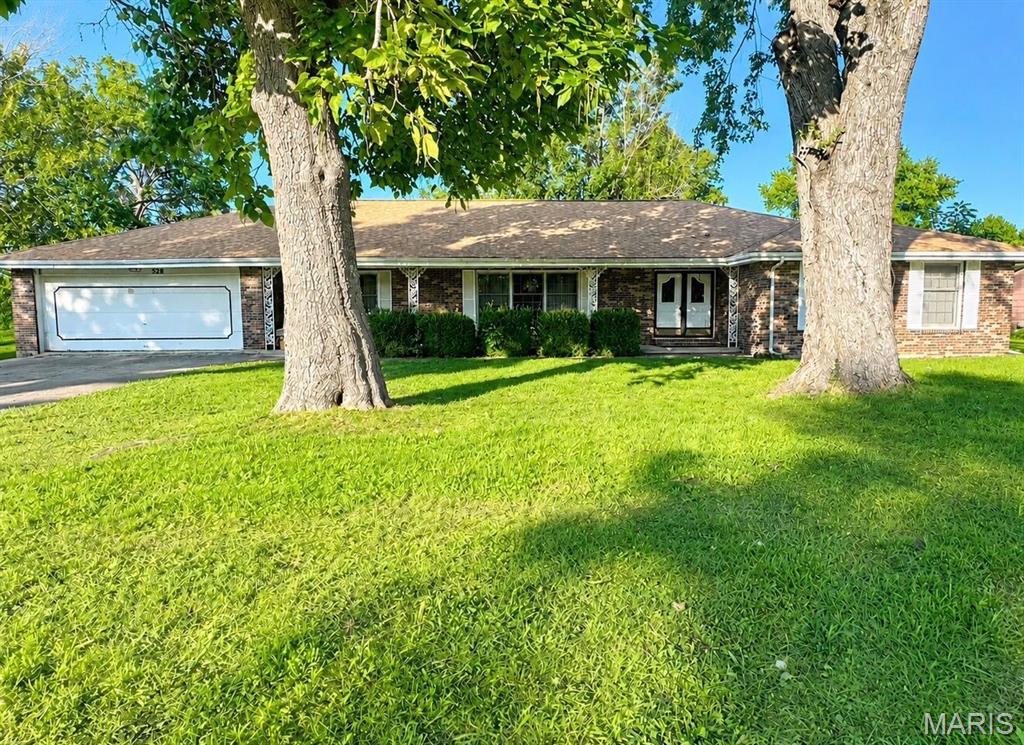 Welcome to this spacious 4-bedroom, 3-bath home nestled on approximately 1.25 acres in one of the area's most well-established neighborhoods. Tucked away at the end of a quiet street and conveniently located just behind the Missouri Veterans Home, this property offers a peaceful setting with an unbeatable location.

Inside, you'll find plenty of room  with a large kitchen, an expansive living and dining room combination, and a second family room featuring a cozy fireplace-perfect for gatherings or relaxing evenings at home. The oversized enclosed sunroom provides additional year-round living space and beautiful views of the shaded backyard. Outside, mature trees create a private park-like setting, while the generous lot offers ample room for gardening, outdoor entertaining, or simply enjoying nature.

With an exceptional one level floor plan, you will appreciate comfort with an abundance of storage. This home is ready for your vision and personal touch.  This is an opportunity you won't want to miss!
