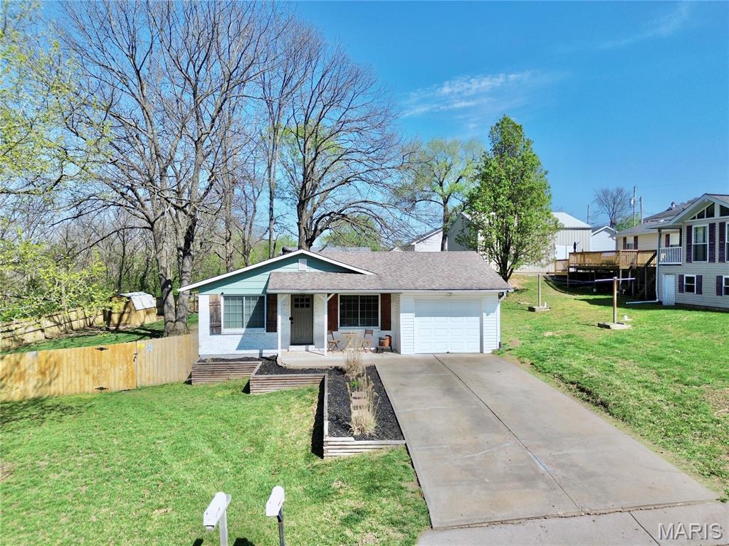 Welcome to this charming 3-bedroom, 1-bath ranch-style home located in the heart of Desoto! This well-maintained property features an open floor plan with beautiful granite countertops, creating a perfect space for both everyday living and entertaining. The updated bathroom includes a modern double vanity, adding both style and functionality.

Enjoy relaxing on the covered front porch during a good rain, or throwing down some burgers on your back deck guarded with a fully fenced yard.—ideal for pets or outdoor enjoyment. Additional highlights include a roof less than 10 years old, an attached single-car garage, and a double-wide driveway providing ample parking.

SHOWINGS BEGIN 6/12

A storage shed in the backyard offers extra space for tools or hobbies. With its convenient location and thoughtful updates, this home is ready for its next owner!