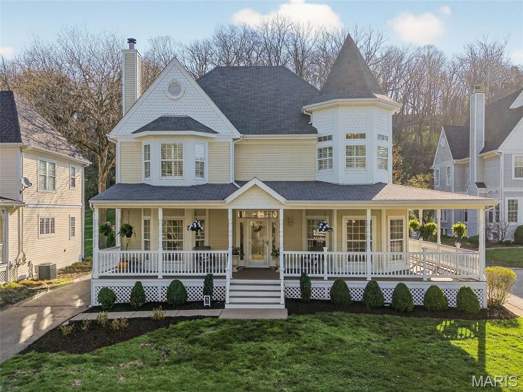 Located on the grounds of the beautiful St. Albans Country Club, this spacious Victorian-styled 2Sty with wrap around porch will WOW you. This 4-bedroom, 4.5 bath home features light-filled rooms, hardwoods, millwork, marble flooring, formal dining room, spacious living room with wood-burning fireplace. Spacious kitchen features white cabinets, quartz counter tops, hardwood floors, large breakfast bar, stainless appliances, NEW refrigerator, attached is spacious breakfast room and light-filled sunroom. Primary bedroom suite offers a cozy retreat, walk-in closet, double vanities, soaking tub, separate shower. Three additional bedrooms, 1 with ensuite, and laundry located upstairs. Lower-level features family room, full bath, 2 bonus rooms (office, workout room, craft room) and play room. This home sits on a beautiful lot which includes invisible fencing...perfect for your furry friends! The irrigation system keeps the lawn green. Enjoy Lake St. Albans, Head's Store, the park and pavilion, it's all just steps from home. Nature's beauty is everywhere you look. 2025 New A/C, furnace, 100G water heater, refrigerator.