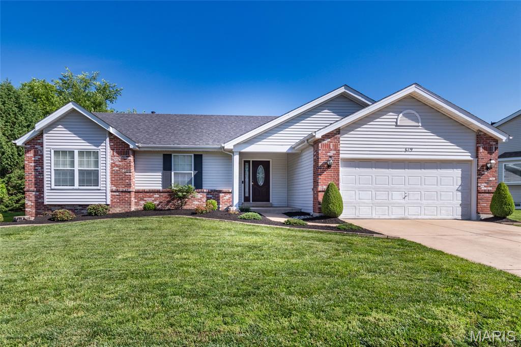 Welcome home to this beautifully maintained ranch in the highly sought-after Green Tree Meadows subdivision in Lake St. Louis! From the moment you enter inside, you’ll appreciate the inviting open-concept floor plan designed for comfortable everyday living and effortless entertaining. The spacious Great Room boasts vaulted ceilings, hardwood flooring, and a cozy fireplace as the focal point of the space. The kitchen opens seamlessly to the breakfast room and offers tile flooring, wood cabinetry, a center island, and convenient access to the main floor laundry. Down the hall, the vaulted primary suite is a true retreat featuring a walk-in closet and an updated private bath with double sink vanity, separate tub, and shower. Two additional bedrooms and an updated full hall bath complete the main level. The finished lower level expands your living space with a large recreation room, full bath, and two versatile bonus rooms perfect for a home office, craft room, guest space, or potential sleeping area. Outside, relax on the patio overlooking the lush backyard. Showings begin 6/23/2026 don’t miss your chance to call this one home!