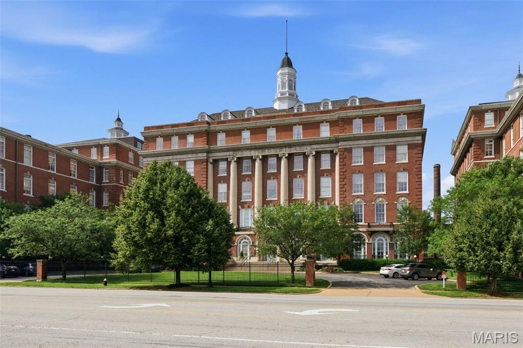 Welcome home to your top floor, South facing, sun-filled unit in the fabulous Georgian Condominiums / aka the iconic former City Hospital building! Featuring over 1,250 sq ft of carefree, one-level living! This well laid out "penthouse" level unit features a fantastic open concept floor plan with 2 bedrooms, 2 full bathrooms, soaring ceilings, split bedroom layout for maximum privacy, a HUGE kitchen and entertaining/dining area, gas fireplace and so much more! Park in your secured, gated and assigned parking spot and enter the gorgeous building lobby, then take your ELEVATOR to the 6th floor — and step inside to find wood floors in the open living room and dining room areas, plus loads of natural light! The large kitchen features tons of cabinetry, a pantry, an expansive amount of granite countertop space, tiled floor and a breakfast bar. The primary bedroom suite features a large bedroom, a huge walk-in closet, and spacious bathroom with step-in shower. The guest bedroom is private & spacious, and also features a large closet. A full 2nd bathroom and spacious laundry room round out the interior. Your monthly HOA fee includes all utilities except internet and the electric you use from outlets (yes, that means AC and heat are also included in the fee)! Gated assigned parking, a dog park, secure mail/delivery room & more. And the lifestyle offering here also includes a quick walk to both Lafayette Square and Soulard, plus close proximity to Downtown and all 3 major interstates for convenient commutes! Come see what carefree condo living feels like at #619 in The Georgian!