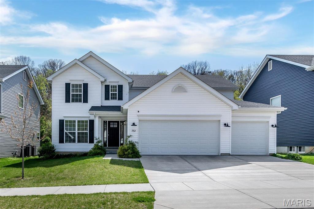 Welcome to this stunning two-story, 4-bedroom, 2.5-bath home with a 3-car garage! The kitchen is the heart of the home, featuring a square center island with breakfast bar, Level 4 painted white 42” wall cabinets, walk-in pantry, and stainless steel appliances. The spacious great room showcases a beautiful window wall that fills the home with natural light, while the formal living and dining rooms provide the perfect space for entertaining. Upgraded wood laminate flooring and 6-foot windows enhance the entire main floor. The luxurious primary suite offers a massive walk-in closet, double vanity, separate shower, and large soaking tub with window for natural light. Upstairs you'll also find three additional bedrooms, a full bathroom, and a convenient second-floor laundry room. Additional features include upgraded lighting, an open spindled staircase, mudroom off the garage, and a ¾ bath rough-in in the basement for future expansion. Located in the beautiful Fox Creek new construction community, this home offers convenient access to shopping, dining, and entertainment just minutes from Gravois Bluffs.