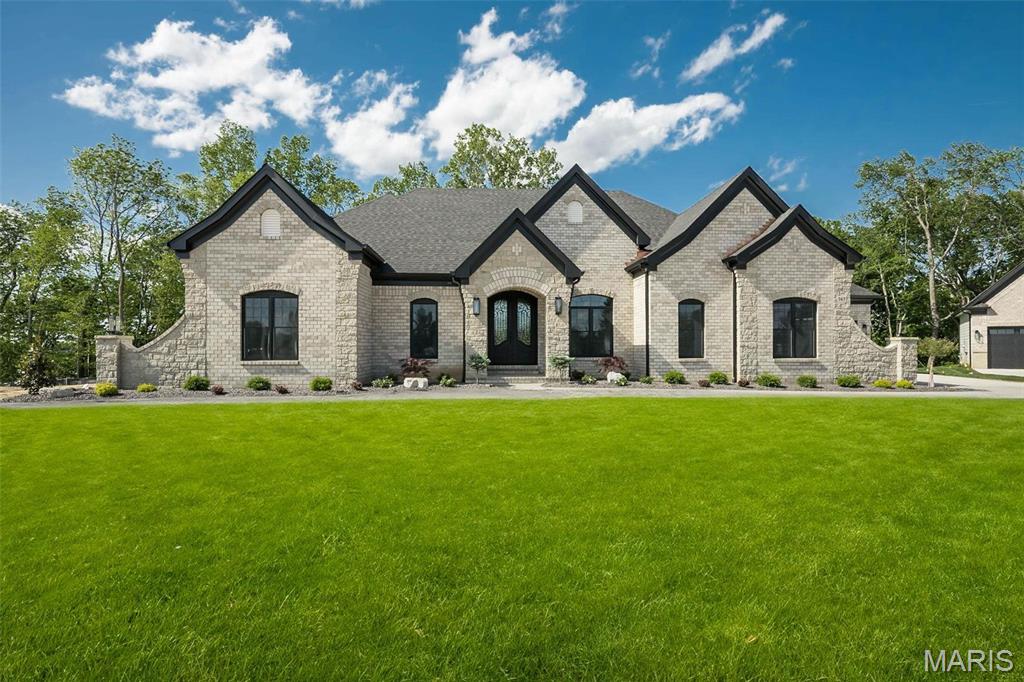 New Construction (HOME TO BE BUILT)! Built by one of St. Louis' premier hands on builders Claymont Development, LLC - Wesley Byrne. The EXCEPTIONAL “ENCLAVE” ranch is a 3/3.5 home of apx 4,500 sqft w/ 4 car courtyard garage. Hand forged wrought iron entry door leads to the foyer w/ 12 ’ ceiling; flanked by formal dining room & office/den. Great room features 12’ ceiling, wall of windows & fireplace paired w/ cabinetry & bookcases. Vaulted hearth room w/ floor to ceiling Masonry fireplace open to the gourmet kitchen w/ HUGE island, all SS appliances, & gorgeous custom cabinetry. Coffered ceiling in Owner’s Suite. Unique brick & stone covered patio. Partially finished walk-out LL includes spacious rec room, custom brick & stone wet bar, 3rd bed & bath. Amenities include onsite pickleball court, walking trail, common ground, & gazebo. Pictures of a previously built home. Tour is of the Display Home