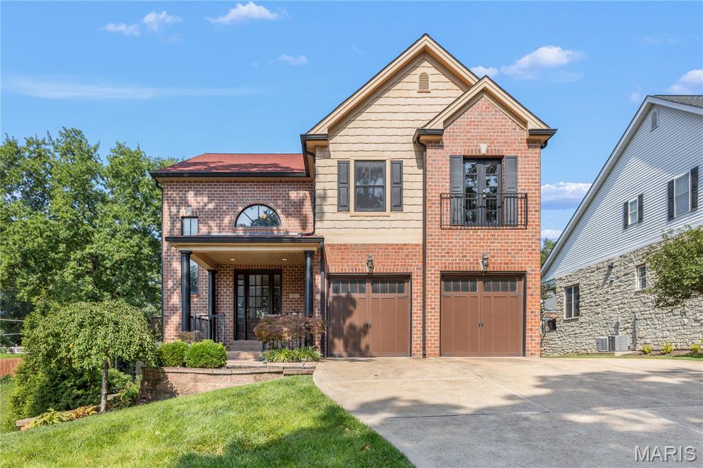 This newer home in sought-after Warson Woods offers the perfect blend of comfort & style, creating an exceptional setting for both everyday living & effortless entertaining. A welcoming covered front porch provides an ideal spot to relax & enjoy the outdoors. Inside, a light-filled two-story foyer showcases a handsome staircase & sets the tone for the home's inviting interior. The formal dining room features rich millwork & an architectural ceiling, creating an elegant space for hosting family & friends. The spacious living room is bathed in natural light & flows seamlessly into the open-concept kitchen & informal dining area, making it ideal for daily living & gatherings alike. The well-appointed kitchen offers abundant granite countertops & cabinetry, a center island, walk-in pantry, & stainless appliances. Step out to the generously sized patio with a pergola. This is an idyllic backdrop for outdoor dining, relaxing, & entertaining. A mudroom, separate laundry room, powder room, & direct access to the attached two-car garage complete the well-designed main level. Upstairs, a versatile landing offers space for a sitting area, homework station, or home office. The luxurious primary suite features two walk-in closets & a spacious en-suite bath. Bedrooms two & three share a beautifully appointed en-suite bathroom, while the fourth bedroom enjoys its own private en-suite bathroom. The finished lower level expands the home's living space with a large recreation room, bonus room, & full bath, offering endless possibilities for entertaining, fitness, guests, or a home office. Additional highlights include a basketball shooting court & a newer roof. Ideally located with convenient access to shopping & dining along Manchester Road, nearby parks, & all the charm of the Warson Woods community, this exceptional home offers the perfect combination of luxury, comfort, & convenience.