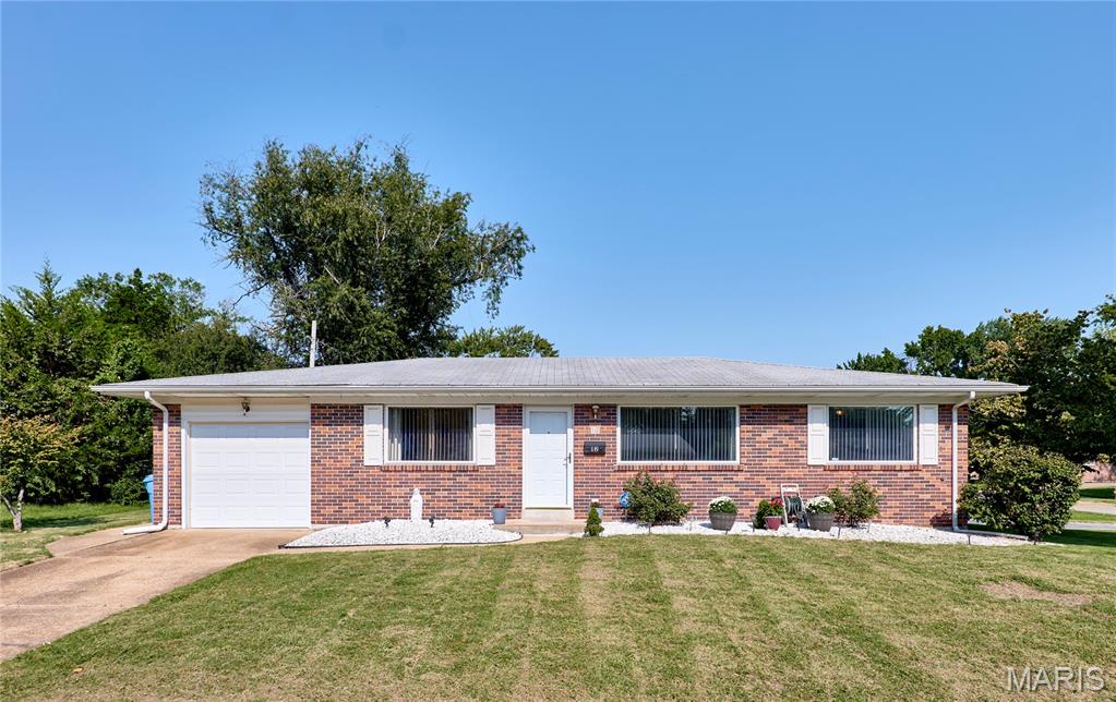 Welcome to this well-maintained full-brick ranch offering 3 bedrooms, 2 baths, tasteful updates, and move-in-ready condition in the heart of Florissant! Beautiful hardwood floors extend throughout the entire main level, while large updated windows with custom blinds, all installed in 2023, fill the home with abundant natural light. The spacious living and dining areas provide a comfortable setting for everyday living and entertaining. The eat-in kitchen features white cabinetry, a pantry, newer stainless-steel appliances, and convenient access to the covered patio and fenced backyard—perfect for relaxing or enjoying outdoor gatherings. A center hall provides easy access to all three bedrooms and both baths. The primary suite and hall bath have both been recently updated, and all three bedrooms offer good closet space. Additional features include a whole-house attic fan and updated HVAC system. The unfinished lower level provides excellent storage, includes a laundry area, and offers plenty of potential for future additional living space. The attached one-car garage features a newer garage door and opener, a service door leading to the covered patio, and convenient access to the kitchen. A 2 car driveway along the side of the home provides additional off-street parking and offers a great opportunity for a future detached garage, subject to applicable approvals. Situated on a level, fenced corner lot in a convenient Florissant location, this home offers easy commuting and close proximity to shopping, restaurants, parks, and other amenities & Hazelwood West schools. Recent updates include all new windows and custom blinds (2023), plumbing stack replacement (2025), new garage door opener and home entry door (2026), updated HVAC, and a recent passing occupancy inspection. Don't miss your opportunity to make this move-in-ready brick ranch your new home—schedule your showing today!