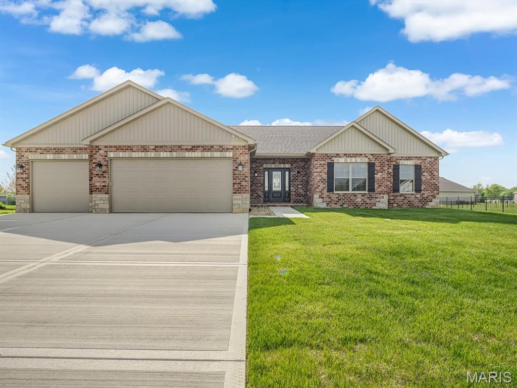 Start off the New Year with this Stunning New Construction in Wildwood West Estates. Welcome to your forever home in the prestigious Wildwood West Estates of Smithton, IL - a peaceful, upscale neighborhood where nature flourishes and majestic eagles soar. Situated on a generous 0.51 acre lot, this newly constructed residence offers 2069 sq ft of refined living space and timeless curb appeal with a stately brick front enhanced by artfully placed stone accents. Step through the covered porch and onto a light-filled great room that flows seamlessly into the dining area and gourmet kitchen. A wall of windows frames the serene backyard views and glorious sunsets, while a cozy fireplace flanked by custom display shelves and a coffered ceiling adds warmth and architectural charm. The kitchen is a showpiece, featuring white cabinetry with gold hardware, quartz countertops, a deep gray island, and stainless steel Whirlpool appliances - including an electric range/oven, microwave, dishwasher, and refrigerator. A walk-in pantry and ample lighting completes this space. Just off the kitchen, a spacious flex room with an attached half bath offers the perfect setup for a home office or guest bedroom. The laundry room includes a utility sink and washer/dryer hookups. Across from the laundry room is the perfect space for a custom drop zone - ideal for organizing coats, bags, and shoes as you enter from the garage. The private primary suite is a true retreat, boasting a generous bedroom, double sink vanity, large walk in shower and walk-in closet. Two additional spacious bedrooms and a full bath complete the sleeping quarters. Downstairs a large unfinished basement provides endless possibilities for future expansion, hobbies, or storage. Outside enjoy a covered concrete porch with recessed lighting, ceiling fan, and brick trim - perfect for relaxing or entertaining and watching the breathtaking sunsets in this country setting. The finished three-car garage includes multiple outlets and a dedicated receptacle for electric vehicle charging. Every detail has been  thoughtfully designed -- this is a home you'll be proud to own for years to come.