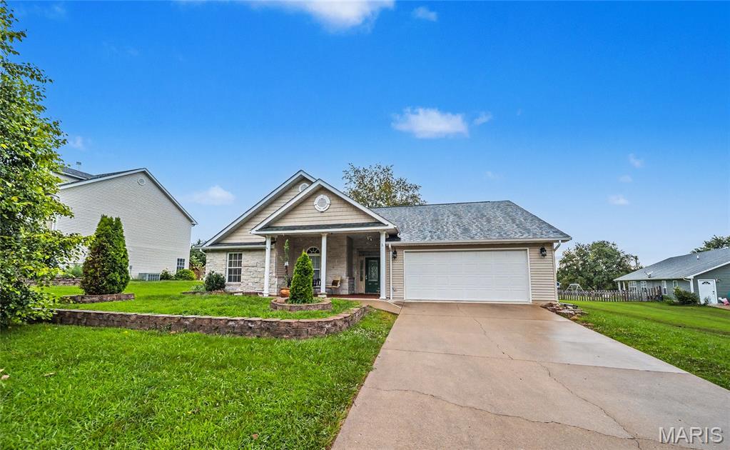 Welcome home to this beautifully updated 3-bedroom, 2-bath ranch offering 1,711 square feet of comfortable living space on nearly half an acre. The inviting open floor plan seamlessly connects the living, dining, and kitchen areas, creating a bright and welcoming atmosphere perfect for both everyday living and entertaining. The kitchen features modern updates, including a stylish tile backsplash, new stove, and dishwasher. The spacious primary suite provides a relaxing retreat, while two additional bedrooms offer flexibility for family, guests, or a home office. Step outside to enjoy the large backyard with room to play, garden or simply unwind near the community pool right out your backdoor! A storage shed offers added convenience , and the attached two-car garage provides plenty of space for vehicles and storage. Located in a desirable neighborhood, this home is just minutes from town and I-44. Book your appointment today.