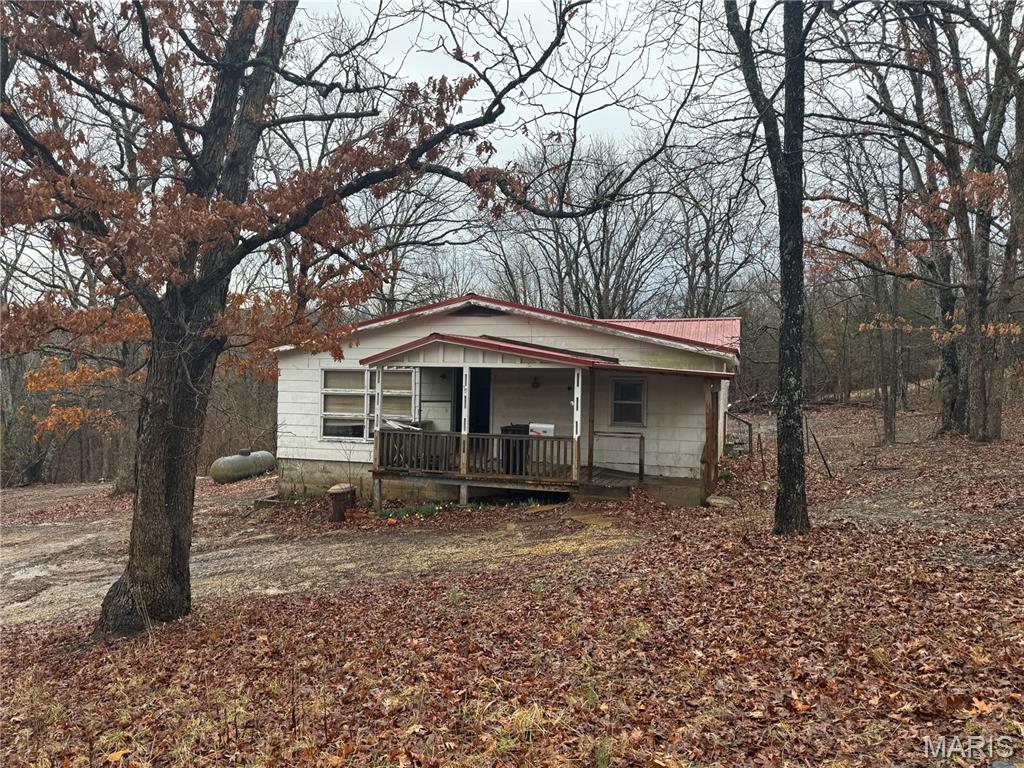 Affordable Home on almost 3 acres m/l Outside the Rolla City Limits! This Blank Canvas is Ready for your Expertise. Just a Short Driving Distance From Missouri S&T and Interstate 44. Home Offers 2 Bedrooms, a Nice Sized Living Room, a Large Kitchen/Dining Room Combination, and a Partial Basement. Enjoy Country Life from the Covered Back Deck. Come see how this Property can Work for your Future Goals!