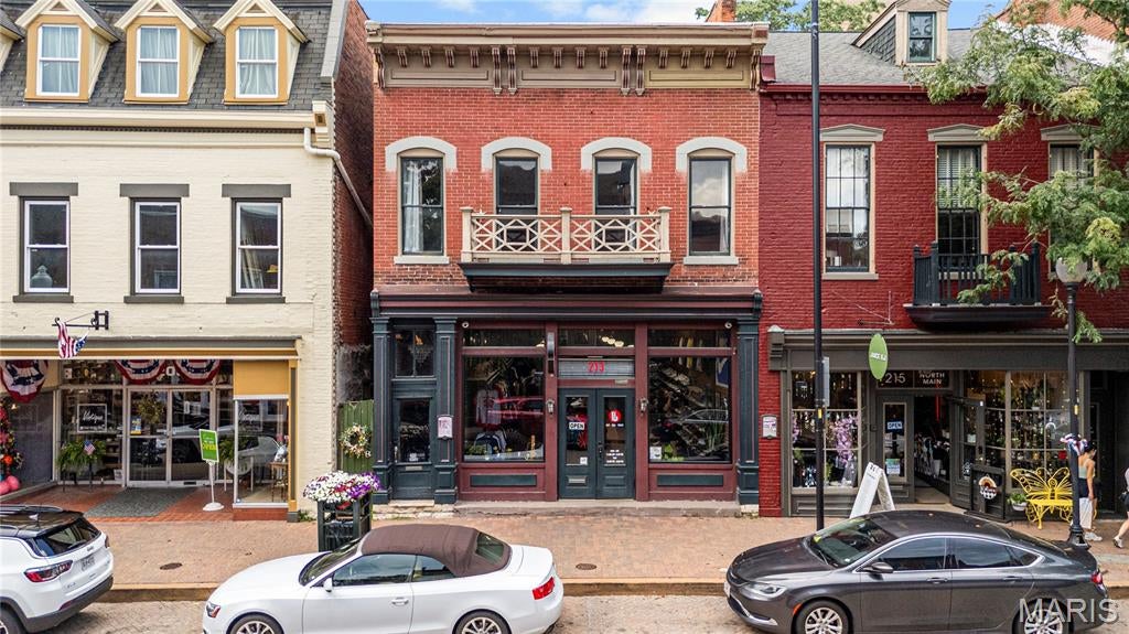 Located in the heart of Saint Charles’ Historic Main Street District, 213 N Main Street presents a rare opportunity to acquire a fully stabilized, income-producing mixed-use asset in one of Missouri’s most vibrant and heavily visited commercial corridors. This circa-1890 brick building offers 4,524 square feet of well-utilized space and generates a true net operating income of approximately $83,000 annually, translating to an attractive 5.35% cap rate at the $1,550,000 asking price.
The ground floor is home to Reset, an established clothing and shoe resale retailer that benefits from the district’s steady, year-round foot traffic. Above the retail level, the upper units operate as income-producing apartment and Airbnb rentals, capitalizing on Saint Charles’ thriving tourism economy and persistent demand for short-term accommodations near the riverfront. This blend of retail and residential income creates a diversified rent roll that insulates ownership from single-tenant risk and delivers dependable cash flow from day one.
Unlike value-add offerings that require capital and lease-up time, 213 N Main is a turnkey investment: the work has been done, the income is in place, and a new owner simply steps into a performing asset in an irreplaceable location. Historic Main Street draws visitors year-round with its brick-paved streetscape, boutique shopping, dining, and signature festivals, including the nationally recognized Christmas Traditions celebration. The property sits steps from the Missouri Riverfront, Frontier Park, and the First Missouri State Capitol Historic Site, with a nearby traffic count of 77,283 vehicles per day and a Walk Score of 79/100.
Downtown Saint Charles continues to benefit from sustained public and private investment, and surrounding values have appreciated 10% over the past two years. For investors seeking stable, diversified income with long-term appreciation in a proven historic district where buildings rarely trade hands, 213 N Main Street is a compelling, low-friction addition to any portfolio.