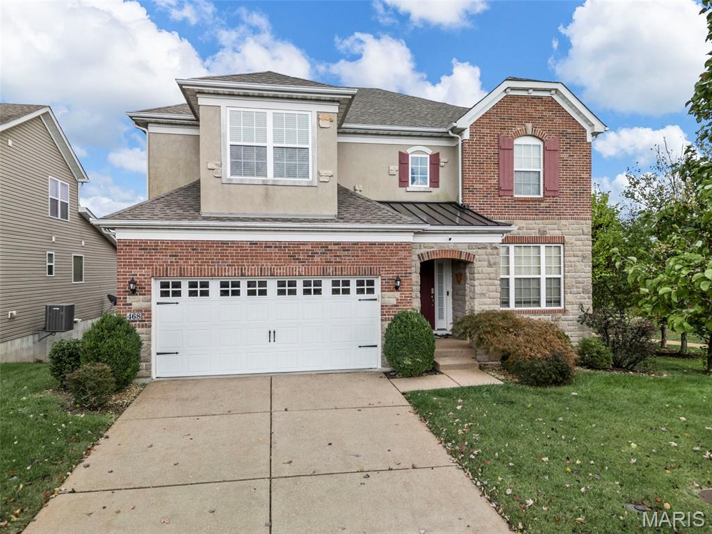 Located in a quiet cul-de-sac in the highly sought-after Reserve at Chesterfield Villages, this beautifully updated two-story home offers the perfect blend of space, style, and convenience in one of Chesterfield’s most popular neighborhoods. Step inside to an open and inviting floor plan featuring wood floors throughout the main level, fresh paint, and brand-new carpet, making this home truly move-in ready. The stunning two-story family room is filled with natural light and flows seamlessly into the spacious kitchen—perfect for everyday living and entertaining. The kitchen features abundant cabinetry, granite countertops, stainless steel appliances, gas stovetop, 2 pantries and a large island with abundant seating. Just off the kitchen is a planning desk/office area, ideal for working from home, managing daily tasks, or a homework station. A large mudroom adds extra convenience and organization for busy households. Step outside to the gorgeous covered deck where you can relax and enjoy the spectacular views—a perfect spot for morning coffee or evening gatherings. The main level also includes a private office space—perfect for working from home—as well as a formal dining room or living room, offering additional space for entertaining guests or hosting holiday gatherings. Upstairs, the spacious primary suite offers a peaceful retreat with a private ensuite bath and walk-in closet. Two additional bedrooms share a well-appointed bath, while the fourth bedroom features its own private bath, making it perfect for guests or older children. A versatile loft area provides additional living space that can easily function as a home office, playroom, or media lounge. The finished walk-out lower level is designed for entertaining and relaxation, featuring a large bar area, theater space, full bath, and plenty of additional storage. Walk out to the patio and enjoy the backyard setting. The garage includes a convenient bump-out area, providing extra space for bikes, lawn equipment, trash cans, and additional storage—a practical feature that helps keep everything organized. Perfectly located in the heart of all the exciting new development in Chesterfield, this home offers incredible convenience with easy access to parks, walking trails, and the local community pool—making it easy to enjoy everything the neighborhood has to offer. This home truly delivers style, space, function, and an unbeatable Chesterfield location near HWY access, and minutes to shops and restaurants! Newer roof and new carpet (2025)