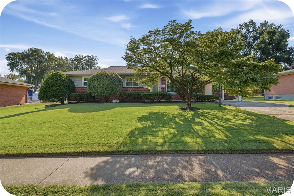 Welcome to this exquisitely renovated mid-century ranch home nestled in this sought-after Crestwood neighborhood! Thoughtfully updated while preserving its original character, this inviting home offers two bedrooms, three full baths, and exceptional living space across two levels. Beautiful hardwood floors flow throughout the main level, leading to a stunning custom kitchen featuring a breakfast bar, granite countertops, and stainless steel appliances. Just off the kitchen, a clever office nook provides the perfect dedicated workspace. The main level primary suite offers a spacious walk-in closet and beautifully appointed en suite bath. The second bedroom features two large custom closets, providing abundant storage. A truly amazing staircase leads to the finished lower level, where you'll find a generously-sized recreation room complete with a fireplace, plus a versatile additional space ideal for a sleeping area. A craft room, reading nook, laundry room, full bath, and plentiful storage complete this incredible flexible level. Out back is a lovely patio with a new gazebo, perfect for hosting bbq's with family and friends and a large, level, easy to maintain, backyard. Recent updates include a new A/C and humidifier (2023), new sump pump w/ battery backup (2021), and new hot water heater (2022). Located within the Lindbergh School District, this home is ideally situated within walking distance of Whitecliff Park, which is slated to welcome a brand new Recreation Center in 2027! Enjoy easy access to Grant's Farm, Grant's Trail, shopping, dining, and all that this wonderful Crestwood location has to offer. Beautifully renovated, thoughtfully designed, and perfectly situated--this is a home you'll want to see!