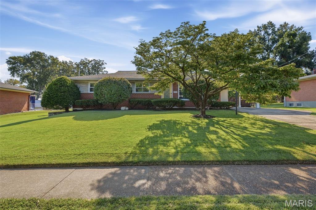 Welcome to this exquisitely renovated mid-century ranch home nestled in this sought-after Crestwood neighborhood! Thoughtfully updated while preserving its original character, this inviting home offers two bedrooms, three full baths, and exceptional living space across two levels. Beautiful hardwood floors flow throughout the main level, leading to a stunning custom kitchen featuring a breakfast bar, granite countertops, and stainless steel appliances. Just off the kitchen, a clever office nook provides the perfect dedicated workspace. The main level primary suite offers a spacious walk-in closet and beautifully appointed en suite bath. The second bedroom features two large custom closets, providing abundant storage. A truly amazing staircase leads to the finished lower level, where you'll find a generously-sized recreation room complete with a fireplace, plus a versatile additional space ideal for a sleeping area. A craft room, reading nook, laundry room, full bath, and plentiful storage complete this incredible flexible level. Out back is a lovely patio with a new gazebo, perfect for hosting bbq's with family and friends and a large, level, easy to maintain, backyard. Recent updates include a new A/C and humidifier (2023), new sump pump w/ battery backup (2021), and new hot water heater (2022). Located within the Lindbergh School District, this home is ideally situated within walking distance of Whitecliff Park, which is slated to welcome a brand new Recreation Center in 2027! Enjoy easy access to Grant's Farm, Grant's Trail, shopping, dining, and all that this wonderful Crestwood location has to offer. Beautifully renovated, thoughtfully designed, and perfectly situated--this is a home you'll want to see!