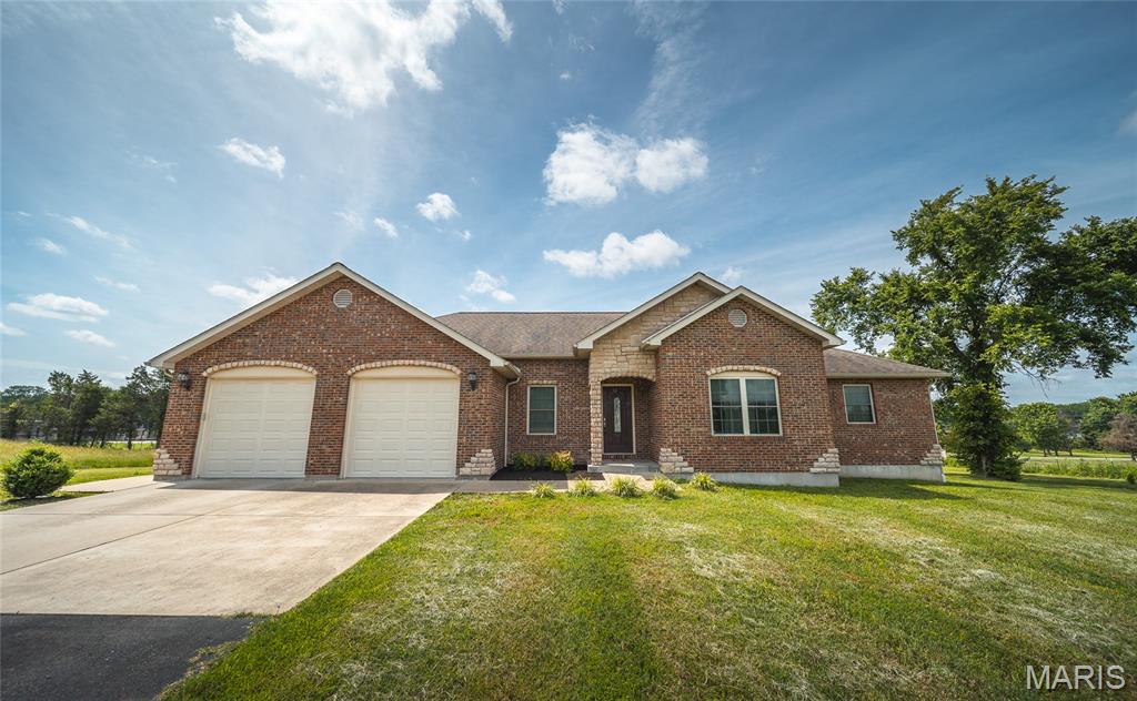 Beautiful brick-front home offering 2,056± sq. ft. of finished living space on a spacious 1-acre lot! This well-maintained home features an inviting open-concept floor plan with the kitchen, dining, and living areas flowing seamlessly together—perfect for everyday living and entertaining.
The spacious Master Suite includes a large walk-in closet and private Master Bath, while two additional generously sized main-floor bedrooms are connected by a convenient Jack-and-Jill bathroom. Enjoy peaceful mornings and relaxing evenings on the large covered back deck overlooking the backyard.
Additional features include a 2-car attached garage, large detached shop with plenty of room for hobbies, storage, or workspace, and a full walk-out basement that is partially finished, offering additional living space and endless potential for future expansion.
With plenty of indoor and outdoor space, this property combines comfort, functionality, and country-style living. Don't miss your opportunity to make this beautiful home yours—schedule your private viewing today!