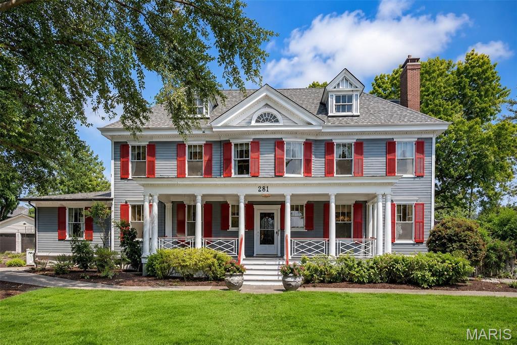 Situated in the heart of the Jefferson–Argonne Historic District in downtown Kirkwood, this distinguished Colonial Revival residence is a rare architectural gem. Lovingly owned and meticulously restored by the same family for more than 40 years, the home beautifully preserves its 1905 character while seamlessly blending timeless craftsmanship with the comforts of modern living. A thoughtfully designed addition introduces a comfortable main-floor bedroom suite with sitting room and an expansive, light-filled kitchen, creating the perfect balance of historic elegance and contemporary functionality. Offering nearly 3,800 square feet of living space, this gracious 2.5 story home features six bedrooms, 3.5 baths, four original fireplaces, picture rail moldings, pocket doors, and exquisite period millwork and casings throughout. Rich architectural details and impeccable craftsmanship create an atmosphere of warmth, character, and enduring charm. An impressive entry foyer welcomes you into the home and is flanked by elegant formal living and dining rooms, setting the tone for the home's timeless sophistication. Beyond the stunning addition, the original first floor has been thoughtfully restored with refinished hardwood floors and fresh paint throughout, preserving its historic beauty while enhancing everyday livability. The exterior has been meticulously renovated to highlight the home's original character and is complemented by a new architectural roof and freshly painted exterior. Extensive professional landscaping in both the front and back yards enhances the property's exceptional curb appeal while creating inviting outdoor spaces for entertaining and relaxation. Additional updates include newer zoned HVAC systems, a new 400-amp electrical panel, a maintenance-free deck, and the convenience of a main-floor laundry and mud room. One of the home's most treasured features is its full-width front porch—a signature element of historic Argonne Drive. From this welcoming gathering place, the owners have enjoyed watching neighbors stroll to the Farmers' Market, local shops, restaurants, and community events, reflecting the close-knit neighborhood spirit that makes this location so special. This is a once-in-a-generation opportunity to own one of Kirkwood's finest historic homes, just one block from the Farmers' Market and vibrant downtown Kirkwood, where historic charm, exceptional craftsmanship, and modern amenities come together in one extraordinary residence.