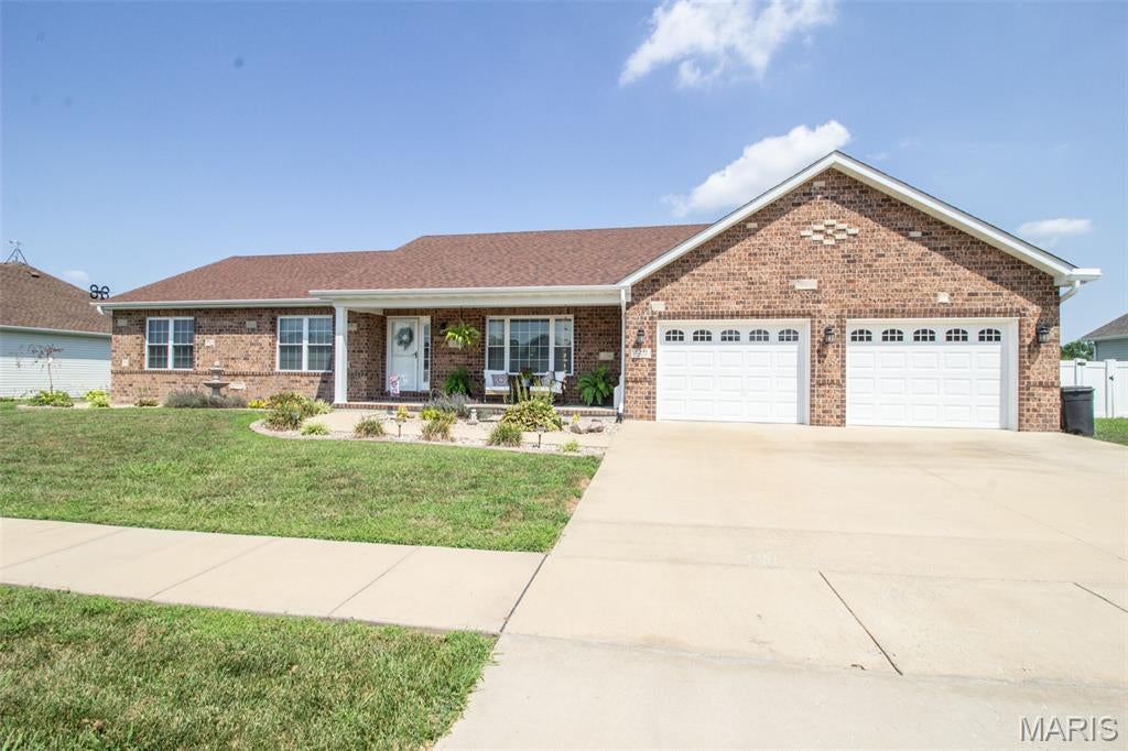 Situated on a large lot is this stunning 4 bedroom, 2 bathroom sprawling ranch! As you walk up to this home, you are greeted by a lovely covered front porch that sets the tone for what is to be found inside. Upon entering you are greeted by a quaint foyer that overlooks the open floor plan living area! Spacious living room features vaulted ceilings, loads of natural light, and a gorgeous fireplace! Flowing right into the dining area, the perfect place for the upcoming holiday season! The kitchen offers loads of cabinet and counter space, and even has a breakfast bar! The primary suite offers ample closet space and a large private full bathroom! 2 additional guest bedroom and large laundry room round off the main level. Downstairs is the perfect place to hangout featuring a family room that includes a custom bar, game room, and 4th bedroom with egress window! The lower level also features plenty of storage space! Outback you will find a large covered patio overlooking the HUGE fenced backyard... AND POOL! This home has it all, all that is missing is YOU! Call for your private showing today! Buyer to verify all MLS data.