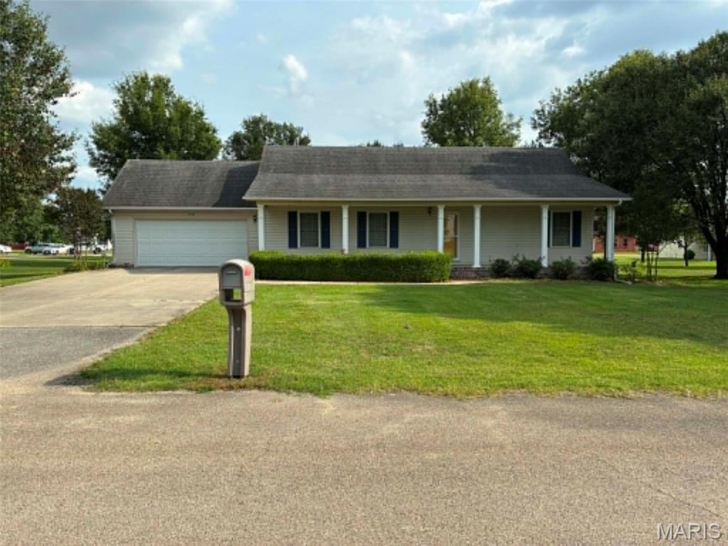 Welcome home to this spacious 4-bedroom, 2.5-bath property offering room for everyone! Designed with an open-concept layout, the home features two separate living areas, providing plenty of space for entertaining, relaxing, or creating a dedicated family room. The basement adds extra storage and flexibility, while the second garage offers additional space for vehicles, hobbies, or a workshop.
Situated on a large corner lot with sprinkler system this property boasts great outdoor space and curb appeal. Enjoy your morning coffee or unwind in the evenings on the expansive front porch. With generous living space, versatile features, and a desirable layout, this home is ready to fit a variety of lifestyles. Don't miss your opportunity to make it yours!