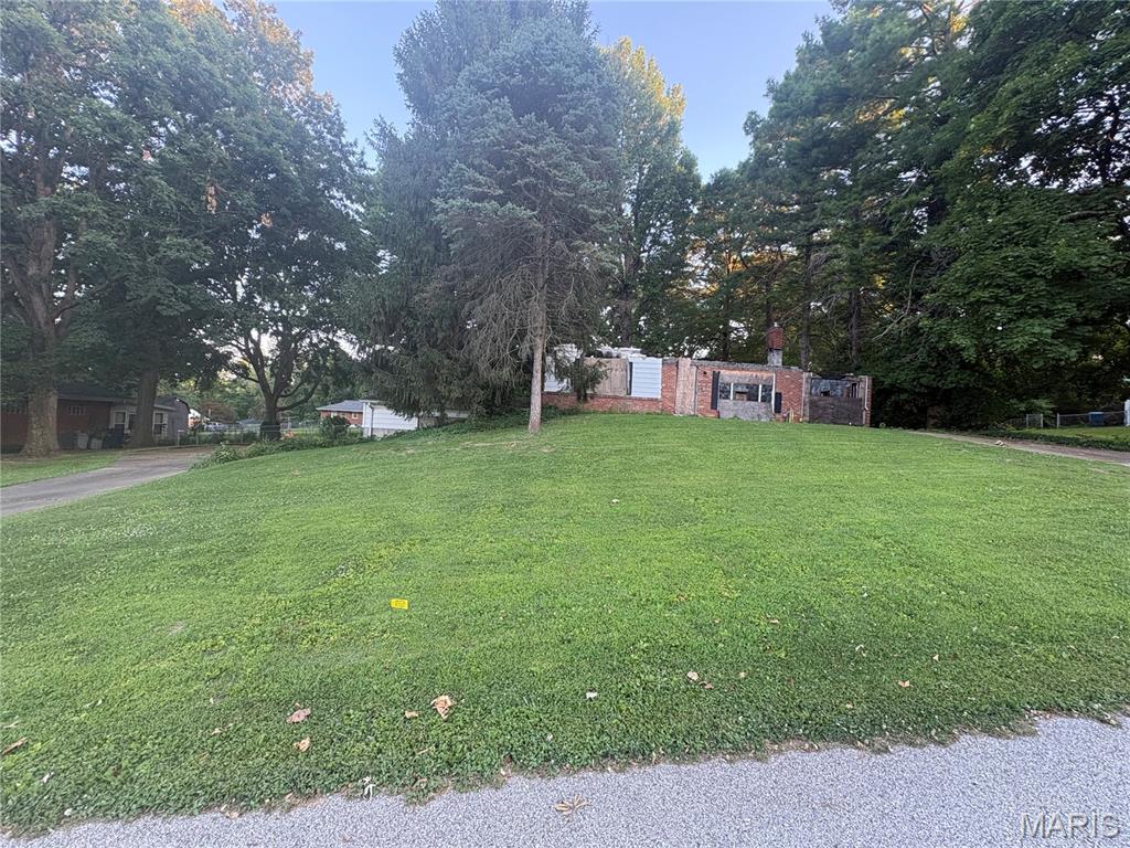 Investor Opportunity in an Established Residential Neighborhood! This property is full of potential and ready for its next chapter. Situated on a spacious lot with a fenced backyard, the property includes the remaining structure of a home that was damaged by fire, along with an intact garage that offers immediate storage or workspace options.

Ideal for investors, builders, or buyers looking for a redevelopment project, this property is located in a desirable residential neighborhood surrounded by established homes. Whether you choose to rebuild, renovate, or start fresh, the possibilities are endless. Conveniently located near schools, shopping, and major roadways. Property is being sold as-is. Buyer to verify all zoning, building, utility, and permit requirements.

**Access to this property may be hazardous due to unstable structures, debris, and unsafe ground conditions. Do NOT enter any remaining structure. Entry onto the property is at your own risk, and all visitors assume full responsibility for their safety. Neither the seller nor the listing brokerage shall be held liable for any injuries, accidents, or damages that may occur while on the premises.