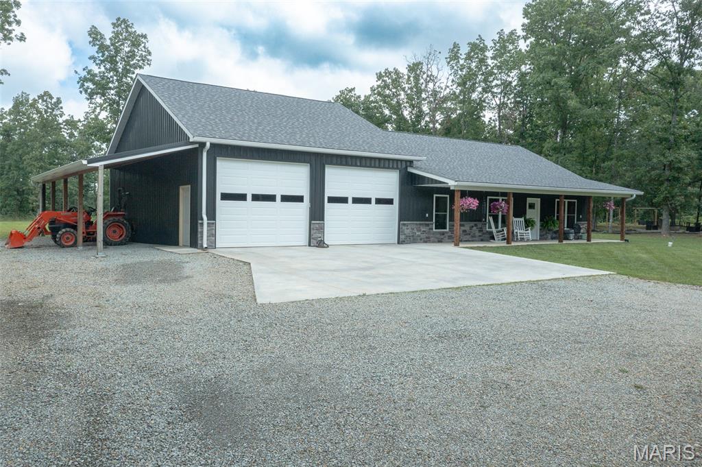 Tucked away on 69+/-  mostly wooded acres, this beautiful 2024 built home offers the perfect blend of modern comfort and secluded country living—all just 15 minutes from town.
The 1,344 sq ft home features a functional, divided floor plan with a cozy living room complete with an electric fireplace. The kitchen is designed for both everyday living and entertaining, offering a center island, stainless steel appliances, granite countertops, a breakfast nook, and a walk-in pantry with ample shelving.
The spacious master suite includes a walk-in shower, vanity with plenty of cabinet space, and a large walk-in closet. On the opposite side of the home, you’ll find an additional bedroom, bathroom, and a conveniently located laundry room with direct access to the impressive 40x31 attached garage—fully heated and cooled, making it ideal for parking, storage, or hobbies.
This all-electric home features hard surface flooring throughout and covered front and back porches to take in the peaceful surroundings. Step right out back to enjoy the above-ground pool, fire pit area for gatherings, and a stocked pond filled with bluegill and catfish.
The acreage is mostly wooded with a recent clearing that would make an excellent food plot, offering great recreational and hunting opportunities.
If you’re looking for privacy, modern amenities, and land to enjoy, this one checks all the boxes!