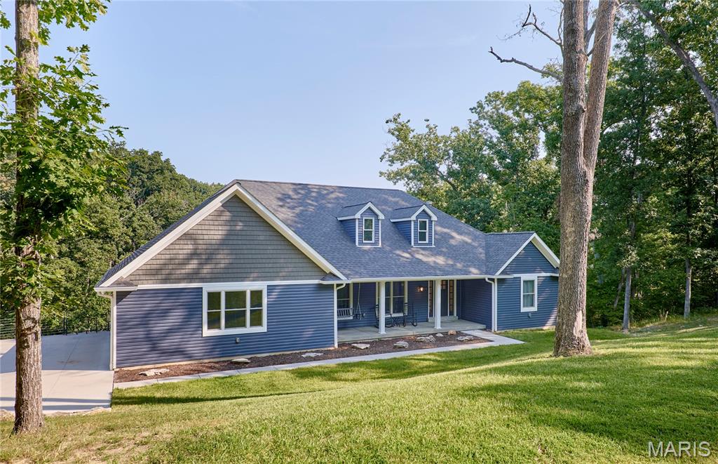 Dont wait !  Homes like this don't come around often in sought after area of Defiance!  Rare opportunity to have a beautiful like new ranch home on 3.05 wooded acres!  paved roads plus concrete driveway and Just minutes to I-64 and Hwy 94 allowing easy commutes yet peaceful country living. 11 ft ceilings and all of the natural light that fills the entertaining area. The kitchen offers tons of white cabinets, stainless farm sink, walk-in pantry, large island/breakfast bar, Quartzite Counter tops and access to huge deck with view of the peaceful, quiet setting-cozy hearth room and enjoy the warmth from the wood burning fireplace-separate dining room or office space-Primary bath has double bowl, step in shower with black onyx surround. All bedrooms have walk-in closets. Laundry/mud room is spacious and the unfinished basement walls are 9 ft, has w/i plumbing and walks out to a second deck-there is a sub basement offering additional space for a work shop, play room or flex space-Top of the line insulation throughout home-Anderson Windows-o/s rear side car garage drywalled and insulated