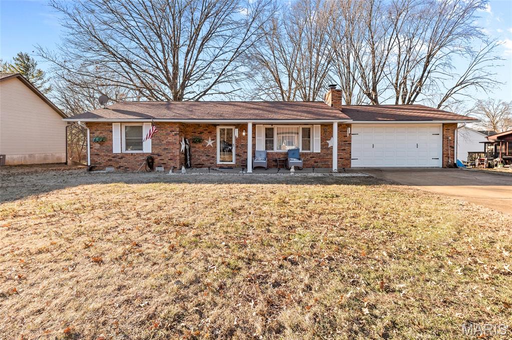 Charming and functional layout. This home is nestled in a small quiet community.   Step inside to a welcoming family room featuring a cozy fireplace, perfect for those cold winter days. The bright eat-in kitchen is filled with natural light and boasts newer cabinetry and countertops, with the pantry cabinet included. Enjoy outdoor living year-round on the covered patio, rain or shine!  The primary bedroom offers a private en-suite bath and a walk-in closet, while a secondary bedroom and full hall bath provide comfortable accommodations for guests or family. Additional highlights include a convenient main-floor laundry room, and a two-car oversized attached garage. Flooring, kitchen, bathrooms, windows, roof, HVAC, H20 heater, and garage doors all have been updated in last 8 years. Seller to make no further repairs or updates. Call today to schedule your personal tour!
