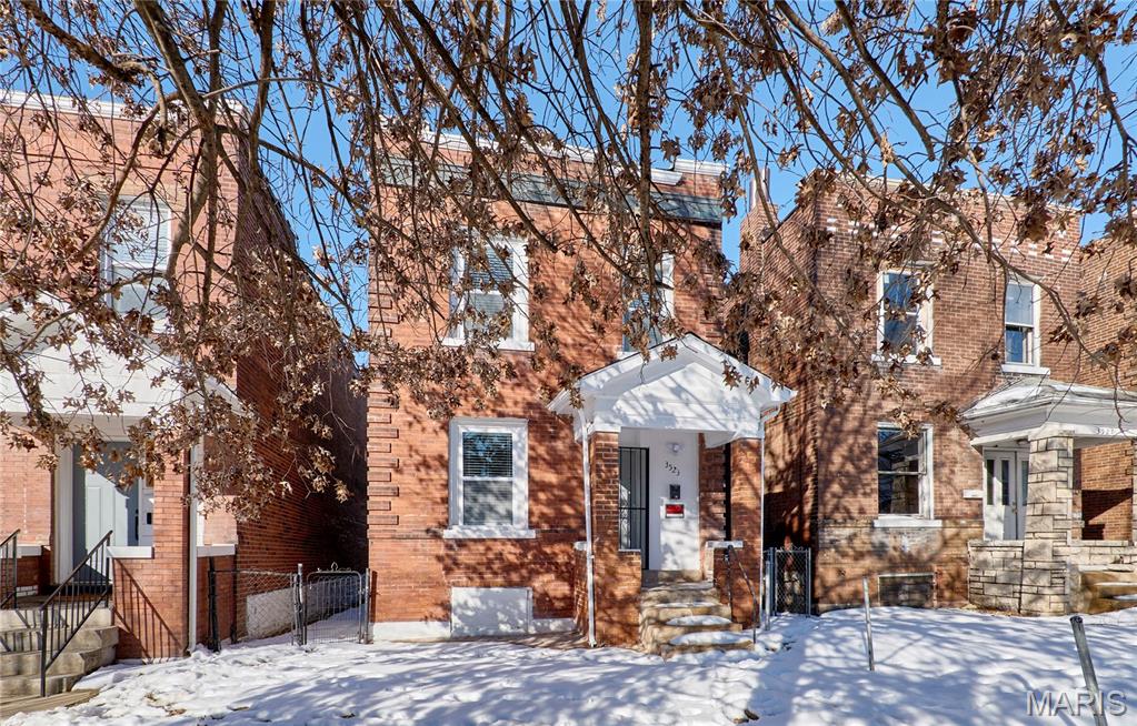 Welcome to this beautifully updated full brick two-story home in the Central East area of St. Louis, offering the perfect blend of historic charm, modern finishes, and urban convenience. Built in 1910, this 3-bedroom, 2-bath residence has been thoughtfully renovated while preserving the character that makes homes of this era so sought after.

Step inside to find tall ceilings, luxury vinyl plank flooring throughout, and abundant natural light enhanced by blinds on all windows. The spacious layout features large bedrooms, walk-in closets, and two decorative fireplaces that showcase the home’s original architectural appeal. Both front and rear staircases provide classic design and functional flow rarely found in newer construction.

The updated kitchen is move-in ready with stainless steel appliances, including an electric range, dishwasher, microwave, and refrigerator. Recent tuck pointing adds long-term durability and peace of mind.

Located near major corridors, this home offers easy access to downtown St. Louis, major employers, hospitals, universities, and public transportation, while still being situated within a residential neighborhood. Enjoy proximity to local restaurants, coffee shops, parks, and cultural attractions that make city living so desirable.

Outside, the fenced backyard creates a private setting for entertaining, pets, or relaxing evenings at home. A recently renovated 2-car detached garage (new roof, fascia, and garage door) provides secure parking and additional storage—an exceptional feature for city living. With solid brick construction, modern updates, historic detail, and a highly convenient location, this home delivers timeless appeal and outstanding value.