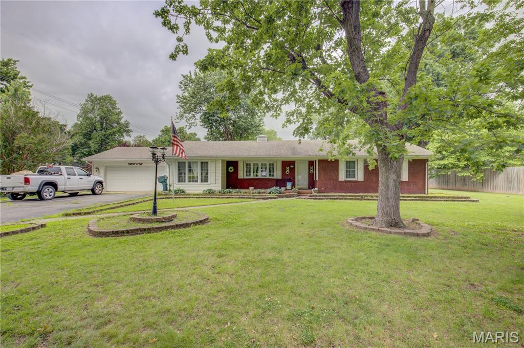 Looking for a wonderful home in an excellent location!?  Here it is!! This one level 3 bedroom 2 bath home is looking for new owners!!  The home is spacious with a great layout for entertaining or a family!  You have 2 living spaces, big kitchen, large bedrooms and bathrooms! The home also has newer flooring, new A/C and newer roof!  Sits on right at .75 of an acre with a fenced in backyard and large patio area!  Tons of storage as well with your attached garage and attached storage area!!  M<ake sure and schedule your tour today!!!!!