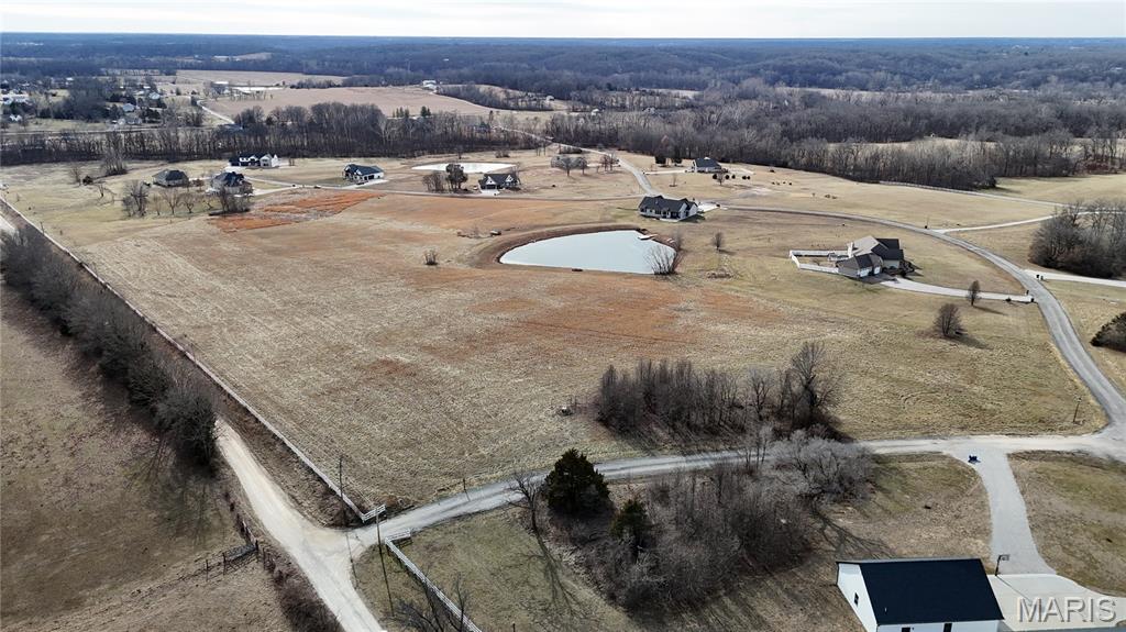 Country living just minutes away from town. This lot is perfect for a custom home build with your own plans and builder. Water and electricity are already on site! Restrictions for owner’s protection. Lots 26 & 27 sold together totaling 6.11 acres offering wide open lots backing to a pond. Dual access to lots via Sassafras Ln & Northern Dancer Dr. Here’s a rare opportunity to purchase two adjacent parcels opening up a range of possibilities for the future owner! No shouses or barndomiuiums allowed.