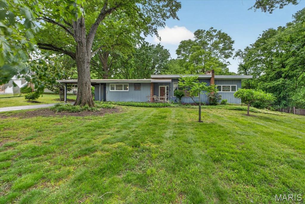 Rare opportunity to build your dream home on one of the premier lots in Des Peres. Situated on the ridge of Topping Lane, this exceptional 1-acre homesite measures approximately 145' x 300' and offers a private, park-like setting surrounded by mature trees and established luxury homes. The gently sloping topography and elevated position near the top of the street create beautiful western views and an ideal setting for new construction. Topping Lane has experienced significant redevelopment in recent years, with numerous custom homes built throughout the neighborhood, making this one of the area's most sought-after opportunities for builders and end users alike. The lot offers ample room for a substantial custom residence, outdoor living spaces, pool, and expansive yard while maintaining privacy rarely found. An existing residence is located on the property and will be conveyed in as-is condition. Interior showings of the home will be available only with an accepted contract. Conveniently located near Des Peres Park, West County Center, The Lodge, highways, restaurants and award-winning schools, this is a chance to secure one of the finest building sites available in mid St. Louis County today.