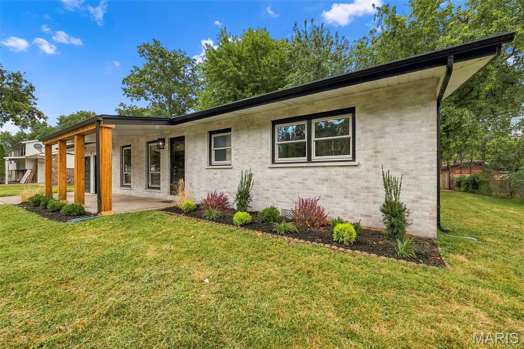 Welcome to this beautifully updated home nestled in the heart of St. Charles! Gorgeous hardwood floors invite you into the bright and open main living space. Offering three bedrooms, two updated bathrooms, and an additional flexible room that could serve as a fourth bedroom, home office, fitness room providing endless possibilities.  The kitchen features 42-inch maple cabinetry, stainless steel appliances, and a convenient breakfast bar. Just beyond the kitchen, the hearth room opens to a spacious covered deck overlooking the partially fenced, level backyard—perfect for children and pets to play. Dreaming of a hot tub or swimming pool? There is plenty of room to create your ideal outdoor retreat.  Additional highlights include a separate dining room with a charming bay window, a main-floor laundry room complete with cabinetry, counter space, and ample storage, plus a rear hallway with a second entrance to the backyard. Neutral paint throughout creates a warm, move-in-ready feel. Both bathrooms have been updated with stylish cabinetry, ceramic tile surrounds, mirrors, fixtures, and hardware.  Freshly manicured landscaping enhances the front and backyard, adding to the home’s wonderful curb appeal.  Roof 2024. Private front yard - faces the side of an estate with lush foliage. Conveniently located near an abundance of restaurants, shopping, and major highways, this charming home has so much to offer. Come see it for yourself—you’re going to love it!