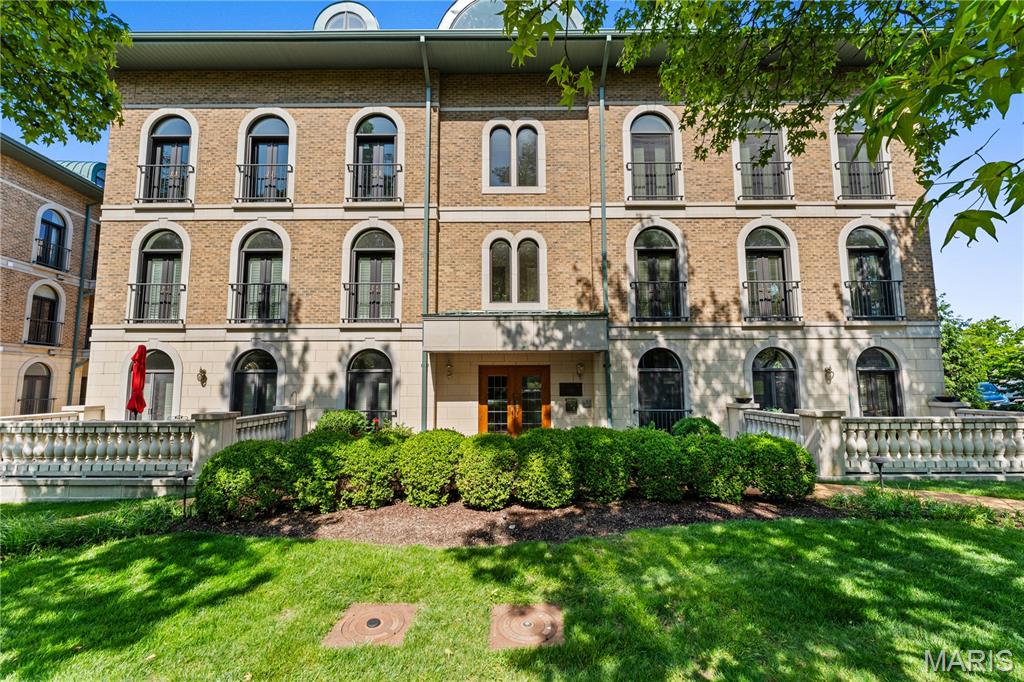 Welcome to 60 Brighton Way #3S, a sophisticated two-level penthouse in a low-rise Clayton building with walkability to restaurants, shopping, and Shaw Park. A private elevator from the garage opens directly into this light-filled third-floor residence. The living room features striking arched windows. The dining room opens to a private patio and includes a bar with a wine cooler. The sleek kitchen features beautiful dark wood cabinetry and a large center island and adjoins the family room, which offers access to another secluded patio. A main-floor en-suite bedroom includes a built-in desk and a walk-in closet. A modern glass staircase leads to the upper level. The primary suite is generously sized, with two walk-in closets, a white marble bath with a soaking tub, a vanity with dual sinks, and direct access to a private rooftop garden with a retractable awning. Another en-suite bedroom and a convenient laundry complete this floor. Two parking spots in the heated garage.