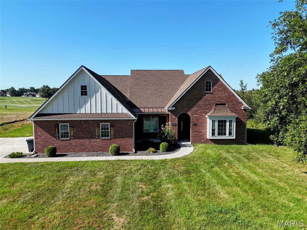 Welcome to 52851 Norwoods Place, where quality craftsmanship and golf course living come together. This beautiful all-brick home offers 3 bedrooms, 2.5 baths, and an open, inviting layout highlighted by tall ceilings, exceptional finishes, and gorgeous flooring throughout.

Designed for convenient main-level living, the home features a spacious primary suite, functional living areas, and a well-appointed kitchen, all on a slab foundation. Upstairs, a versatile bonus room provides the perfect space for a home office, playroom, hobby area, or additional living space.

Step outside and enjoy peaceful views as the backyard backs directly to Norwoods Golf Course. Additional features include geothermal heating and cooling for energy efficiency, a 2-car attached garage, and the low-maintenance durability of an all-brick exterior.

This is a rare opportunity to own a well-built home in one of Hannibal's most desirable golf course communities.