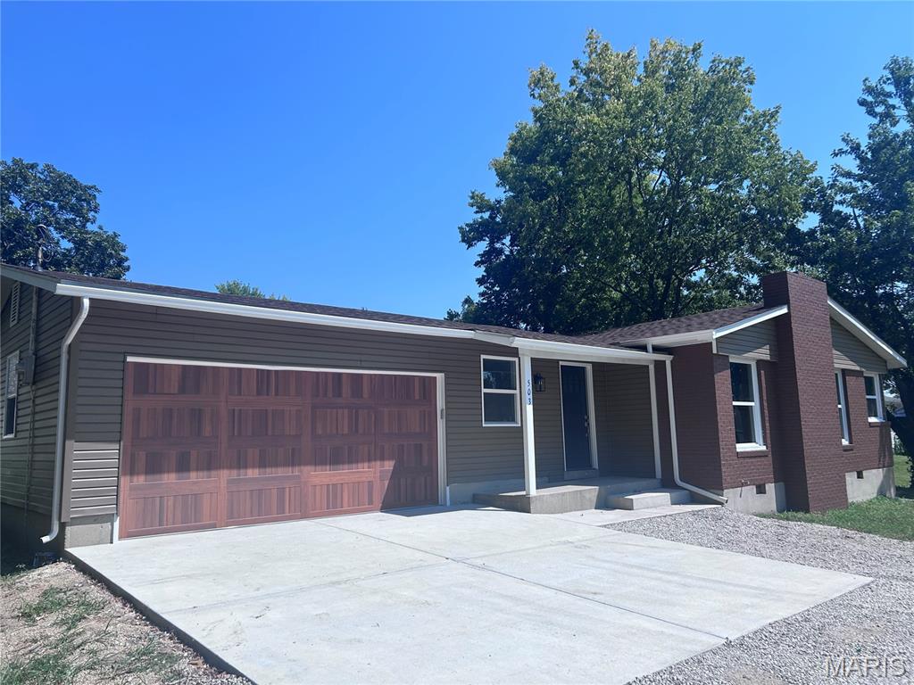 Completely Remodeled sweet home has a mixture of modern appointments to Mid Century charm.  Enter through a beautiful front door to a foyer' hosting a coat closet in this Large home directing filtered lighting Though the many windows. Rich new flooring compliments your furnishings perfectly in the large open living room - dining room -- kitchen with a beautiful Island.  The brick fireplace is the center of this area.  Large bedrooms with good closet space and a private master bathroom are located on the back end of the home for privacy. The guest bedroom has a private concrete outside patio to enjoy a pleasing afternoon on or morning coffee.  A center hall full bath takes care of all that visit.  Access to this fabulous garage with remote is direct from the inside with ample room to add your special touches.  This home sits at the end of the road facing a different direction than everyone else so privacy is provided too. Walk to the Grocery Store, Hardware Store, Post Office and many of the fine Restaurants found in Cuba.  The back faces an open country wooden fence large yard lined with Fir Trees. A new house is being constructed behind it and before it on the cross street.  In addition, Cuba has many wonderful places to visit with a strong sense of community.  Crawford County host tons of acres of National and State Forestry land, the Meramec River, 2 Creeks - Courtois and Huzzah,, Historical Dillard Mill, Red Bluff, Ghost Towns and more.