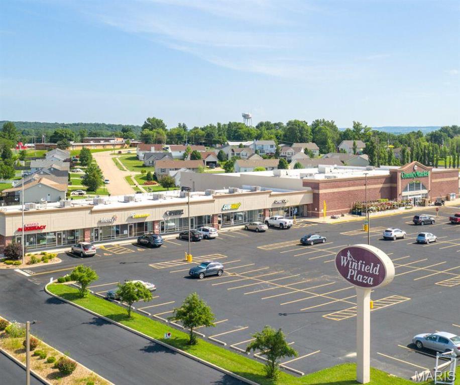 Retail, Office or Medical Space For Lease~ 1,200 sq ft space and 6,000 sq ft space currently available (MLS # 26042857). Position your business in one of Winfield's premier neighborhood shopping centers. This 6,000± square foot commercial space offers an existing church buildout with flexible floor plan options that can be adapted for a variety of retail, medical, office, restaurant, fitness, educational, or service-oriented users. Located within Winfield Plaza, a 43,649± square foot retail center anchored by County Market, this location benefits from consistent daily traffic generated by a strong mix of national, regional, and local businesses. Co-tenants include Subway, Don Julio's Mexican Restaurant, Mercy Family Medicine, SSM Physical Therapy, Dentistry of Winfield, Winfield Pharmacy, and O'Reilly Auto Parts, creating a convenient destination for shoppers and professionals alike. The property features excellent visibility along Missouri Highway 47, ample parking, easy ingress and egress, and convenient access to surrounding communities. Winfield Plaza serves the growing populations of Winfield, Moscow Mills, Troy, Hawk Point, and eastern Lincoln County while remaining less than 20 minutes from Wentzville and approximately 30 minutes from St. Charles.
Whether you're expanding an existing business or launching a new location, this space offers exceptional flexibility in an established retail environment with strong co-tenancy and a built-in customer base.