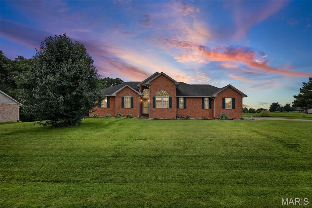 Sitting on 1.34 acres in a quiet neighborhood, this beautiful brick home offers scenic pond views, generous living space, gorgeous sunset views, and thoughtful updates throughout. Featuring 3 bedrooms, 3 full bathrooms, and a versatile bonus room in the basement, the open-concept layout creates an effortless flow for both everyday living and entertaining. Recent improvements—including updated kitchen appliances (2024), a new water heater (2025), and additional interior and exterior enhancements throughout—add modern convenience and move-in-ready appeal. Complete with a 2-car garage, expansive outdoor space, and a beautiful pond setting, this property provides a peaceful setting with space to enjoy both indoors and out. Agent related to seller.