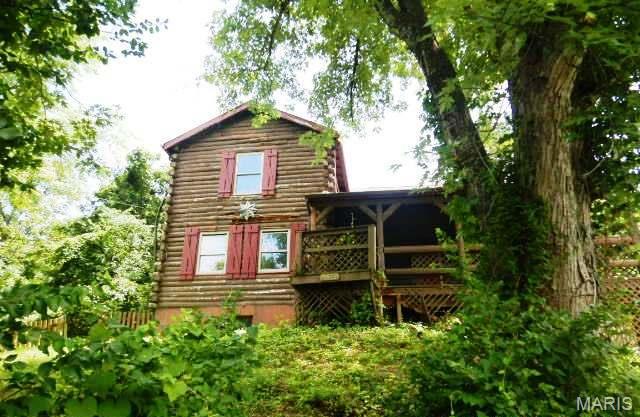 1.5 story log cabin style home situated on over five acres. Attached two car garage, tuck under two car garage and more. Needs a renovation but priced accordingly Great opportunity, so much character and charm. Needs some repairs and upgrades. Make this homes your today!

. Buyer to Verify all information and mls data.