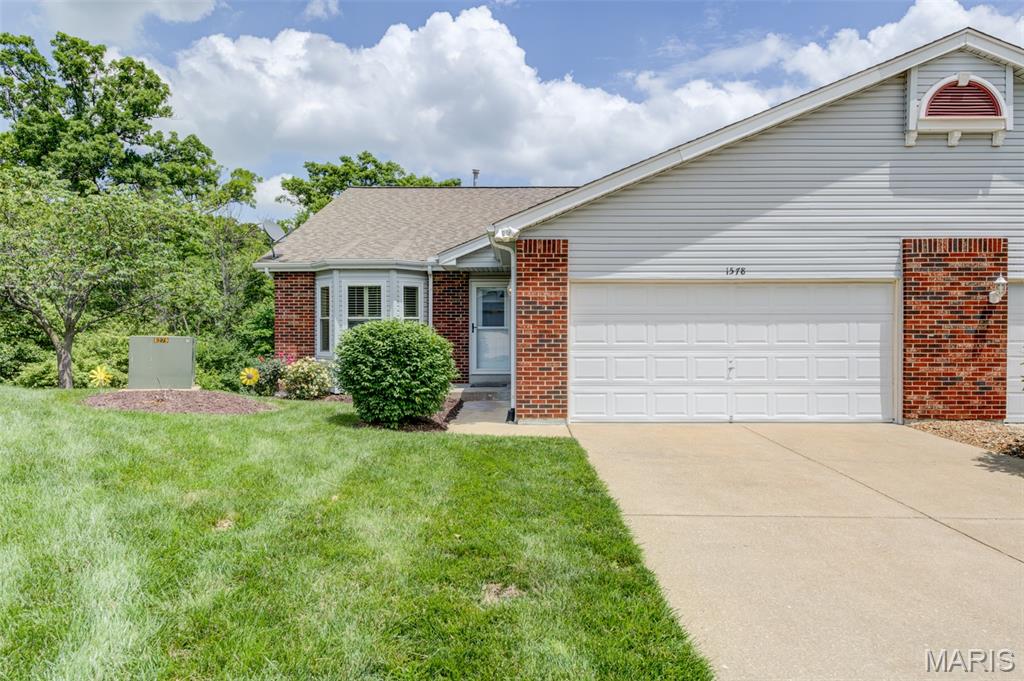 You're going to love this atrium ranch villa! It offers a large primary ensuite including a soaking tub, separate shower, double sinks/vanities & a guest bedroom with private bath on the main level with a lovely, vaulted Living/Dining Room combo; a cozy kitchen with 42" cabinets, a newer stove, microwave, dishwasher & pass-through opening to the Dining Room; & lastly, a convenient laundry room that can be closed off with double 6-panel doors.  Step down the open stairs to the lower level where you'll find a spacious family room sporting a gas fireplace, sunny windows and a door to the backyard & patio.  Also, a bonus 3rd bedroom is steps away from the family room, along with a 3rd bath for guests. Rounding out the lower level is a huge, unfinished storage area, great for all those holiday decorations.  Of course, you will enjoy parking your vehicles in the oversized 2-car garage to keep them safe from the weather.  This move-in ready villa has a lot to offer:  New sliding doors with automatic blinds inside leading out to the side patio, several newer windows (also with blinds inside), bay windows, vaulted ceilings, double doors to the primary suite, beautiful wood floors, ceiling fans, newer storm door, all new faucets (with shut-off valves) in the bathrooms, plantation shutters, a spa hookup on the back patio, 6-panel doors and a beautiful view of the natural wooded area out back.  Close to shopping & good access to major highways. The HOA covers snow removal of the driveway as well as the sidewalk & porch, the roof, lawn care/maintenance & the exterior of the villa. This villa is being sold "as-is," but is move-in ready. Seller is providing a 1-yr home warranty for peace of mind.  Hurry before this one is gone!