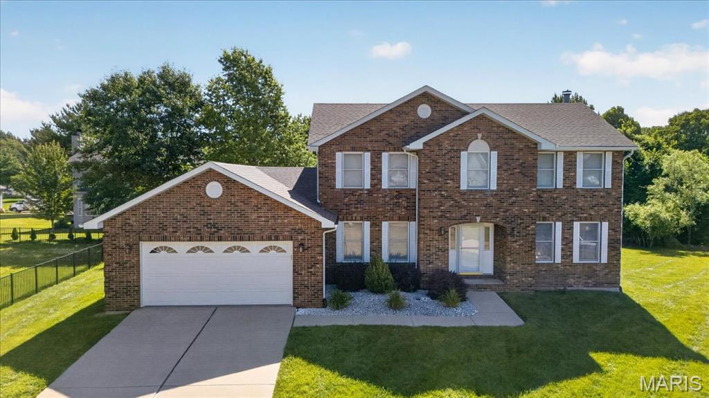 PERFECT FOR YOU with 5 bedrooms, 3 full bathrooms, oversize 2-car garage, main floor bedroom and laundry! New roof 2020. The lovely entry with wood floor is open to living room, family room with wood burning fireplace and dining room. All appliances are included: washer, dryer, gas stove, refrigerator, dishwasher and disposal. Seller is offering a one-year Guard Home warranty - $649.00. The primary en-suite includes an 8 x 6 walk-in closet and bathroom with generously sized shower and soaking tub. There is another full-bath and 3 more bedrooms to complete the second story. The electric is 200 AMP. Downstairs you will find a full unfinished basement with stemmed-in bath as a blank canvas where you can create your dream space. Outside you will love the spacious backyard with 12x14 composite deck. You could live close to the bike trail, YMCA, schools, restaurants, shopping, SIUE, movie theatre, about 20 minutes to St. Louis and less than 40 minutes to Scott Air Force Base! Call your favorite Realtor today to schedule your showing.