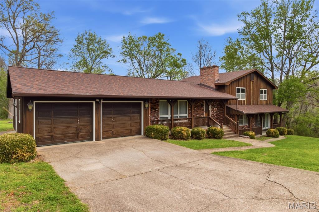 Rare opportunity to own 7.96 acres of beautifully maintained property in the heart of Houston, Missouri--where space, quality, and location come together seamlessly. This immaculate, move-in ready 4 bedroom, 3 bath home offers two expansive living areas, including a formal living room and a stunning oversized family room with fireplace, perfect for entertaining or relaxing. The layout includes two master suites, providing flexibility for guests or multi-generational living. The large kitchen features abundant cabinetry and workspace, with appliances that still present like new. A heated and cooled sunroom adds additional year-round living space and showcases views of the meticulously kept grounds. Step outside to a back deck overlooking the park-like setting, along with a gazebo, and well-equipped shop with workshop space. The property also includes an outbuilding with horse or calf stall--offering versatility for a variety of uses. Built in 1970, this home has been exceptionally cared for, and it shows at every turn. The home and entire property are in outstanding condition, truly setting it apart. Located within city limits, this rare offering provides acreage living with the convenience of being just minutes from shopping, schools, and everyday amenities. Outdoor recreation is close by with easy access to Mark Twain National Forest, Big Piney River, and the Current River. A property of this caliber, condition, and location is hard to find.