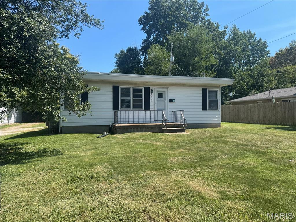Great Investment Opportunity! The sale on 546 N 40th has 2 residential structures, labeled as front and rear, and an additional .03 parcel lot. The posted MLS information is for the front residential structure. The front property is currently vacant and available. You could live in the front structure and rent the rear structure. This property offers a welcoming Living Room with decorative fireplace and newer flooring, Opening to the Dining Area and Inviting Kitchen with Pantry, and Appliances that stay! Both Bedrooms are Nicely sized and features newer flooring! The conveniently located Hall Full Bath is Fresh and Clean with Newer Flooring! Enjoy easy access to the one car garage and unfinished basement, complete with washer & dryer! A door off Kitchen provides convenient access to the carport!  The rear property currently has a leased tenant, paying $575/month with a lease through 9/30/26. As of 10/1/26 the rent will increase to $600/month. The structure is a 1Bd/1Bth approx 609 sq ft, unfinished basement, 1 car garage, and 1 car carport. Tenant pays All utilities, and takes care of the lawn. List price is a reflection of the properties being Sold as-is, and seller to make no repairs. Tenant rights. Buyer to verify information.
