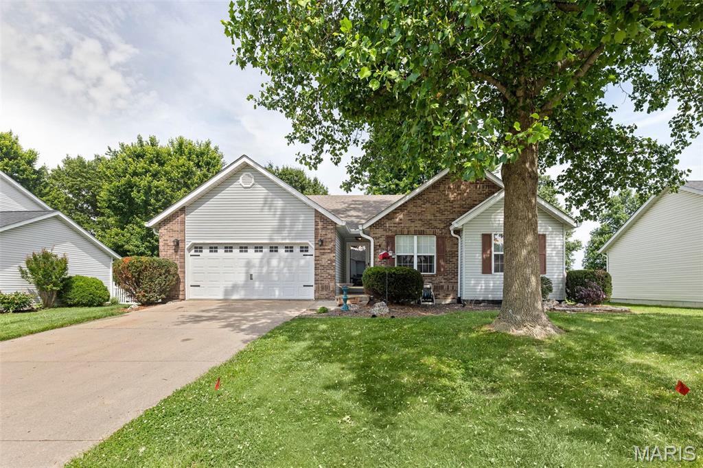 Well-maintained home with a beautiful backyard featuring lush grass, a new deck, and views of a nearby pond. The living room offers plenty of natural light, a wood-burning fireplace, ceiling fan, and a comfortable, inviting feel. The dining room is centrally located and opens to both the kitchen and living room, creating a practical layout for everyday living. The kitchen features stainless steel appliances, modern fixtures, and a spacious breakfast nook with access to the patio overlooking the pond. The lower level includes a family room and a bonus room that can be used as an office, hobby room, or additional living space. Washer and Dryer not included in sale.