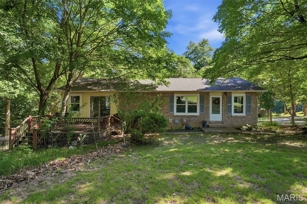 Situated on 4.75 scenic acres within the highly sought-after Jefferson R-7 School District, this spacious and versatile 4-bedroom, 2-bath home offers ample living space both inside and out. The main level features two bedrooms, a full bathroom, a well-appointed kitchen, dining room, comfortable living room, convenient laundry area, and a bright sunroom that provides additional living or entertaining space.

The walk-out lower level serves as a separate living quarters, making it ideal for multi-generational living and guests. This level includes a full kitchen with a sitting area, living room, 2 bedrooms, a full bathroom, a dedicated laundry area, and direct access to a covered patio.

Outside, you'll find plenty of room to enjoy country living with a partially fenced yard, playground area complete with a swing set, exciting zipline, and a peaceful fish pond. With nearly five acres of land, abundant living space, and unique outdoor amenities, this property offers the perfect blend of comfort, functionality, and recreation.

Recent updates include New water heater (2026) and new DH Allweld vinyl windows (2024)