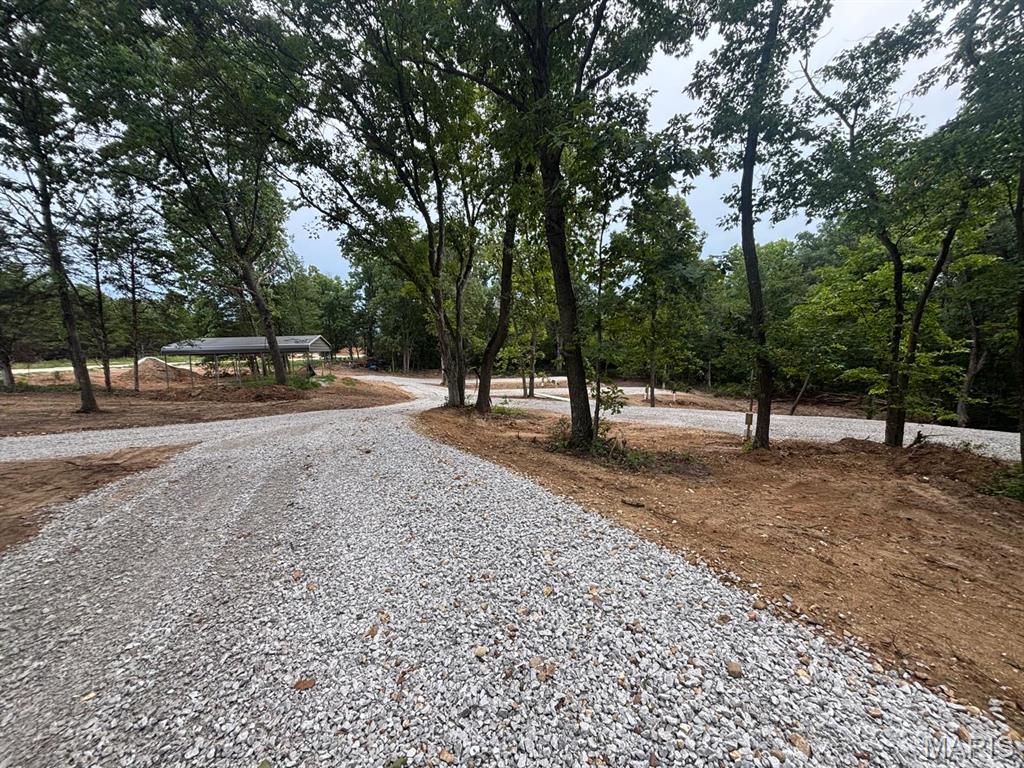 Don’t miss out on this exceptional opportunity to own one of the most sought-after properties near Mark Twain Lake! Located just minutes from Jellystone Park and Roosters Bar & Grill, this 3.9-acre tract offers the perfect combination of seclusion, recreation, and convenience.

This mostly wooded property features mature hardwoods and is ideal for a private retreat, investment opportunity, or small RV getaway.

Property Highlights- 4 RV Pads – Each with full hookups including water, electricity, fiber optic, and sewer -- Large Pavilion – Perfect for gatherings with family and friends -- 3.9 Acres – Secluded, wooded, and serene -- Abundant Wildlife – Deer, turkey, squirrels, and rabbits -- Adjacent to Corps Ground – Non-hunting area for added peace and privacy.

Enjoy boating, fishing, and hiking at Mark Twain Lake, or take advantage of nearby hunting, camping, and shooting activities. Whether you’re looking for a private getaway, investment property, or mini campground, this unique tract offers endless potential.

See it. Love it. Own it. Don’t wait — this rare find won’t last long!